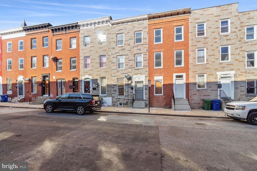 PRICE REDUCTION! This beautiful townhouse offers three  completely  renovated levels out of four levels.  Boasting a solid structure and good bones.  The third level offers  two spacious bedrooms, the second level offers two bedrooms and one full bath and the main level offers a large living room, dining room, a half bath and a spacious kitchen with access to the fenced in backyard.  With unfinished basement.  This property is conveniently located minutes from M & T Bank Stadium, one of the hottest neighborhoods,  near Harlem Park, and convenient to I-95, I-395 and I-695.  SUBMIT YOU OFFER TODAY!