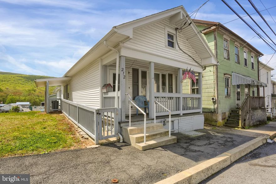 Need easy living, here is the home for you.  This quaint 2 bedroom, 1 bath ranch home in the Borough is clean, freshly painted with new flooring with full bath that accompanies laundry hookups, outside ramp access to main living/dining room combo, with abundant porch spaces, and front, side, and rear access doors  Enjoy the double lot back yard which is fully fenced with a nice back porch and maintainable yard overlooking the valley.  200-amp service, replacement windows, and architectural shingle roofs have been updated in the past.  You'll love the double-decker garage at the rear to the property that has room for one car entrance, and a workshop above for all your project needs.  This home is affordable, well-maintained by prior owner, and is move-in ready condition.  Give a call today and get in by summer!