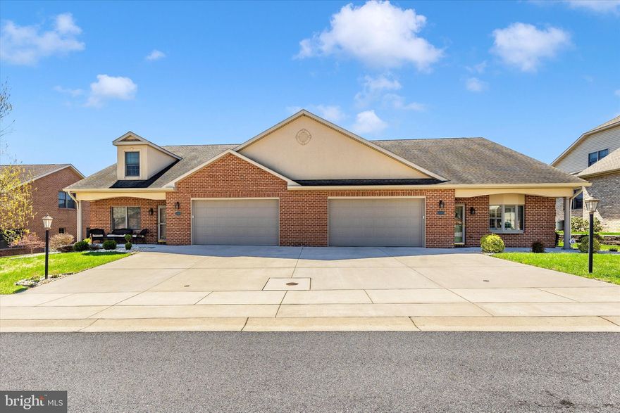 Impeccable brick home in Emerald Pointe, a perfect combination of luxury and comfort! Inviting porch, the main floor is recently painted and boasts 9-foot ceilings, living room with gas fireplace and hardwood flooring, the kitchen offers tile flooring, stunning marble countertops, cherry cabinets, island, stainless steel appliances, pantry and flows into the spacious dining area. The sunroom is the perfect spot to relax, leading to a brick patio. The primary suite has new carpet, and the enclosed bathroom offers a skylight, double marble vanity, and large closets. The upper floor offers a recreation room, and a guest suite  with full bath. There is also a laundry/mud room and a two car garage. Make this your home and live worry free with all the amenities this community has to offer, pickleball, shuffle board, indoor heated pool, state of the art gym/fitness center, catering kitchen and large community center for community activities!