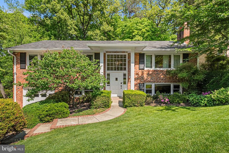 Welcome to 26th St, tucked away at the end of a quiet residential street for an added sense of privacy and seclusion in Arlington's sought-after Donaldson Run neighborhood. This split foyer home delivers 4 bedrooms, 3 bathrooms, and a versatile two-level layout designed for everyday living and easy entertaining. The living room is filled with natural light from a large picture window and features a fireplace and built-in shelves, flowing into a fully renovated kitchen with a large island, top-of-the-line stainless steel appliances, quartz counters, and an abundance of cabinet and counter space. The primary bedroom offers a peaceful retreat with an updated ensuite bath and two walk-in closets. Two additional bedrooms and an updated hall bath complete the main level. Downstairs, sunlight pours into a spacious family room anchored by a second fireplace and a kitchenette with wet bar, wine fridge, and toaster, along with a bonus room and full bath that work well for guests, a home office, or a gym. Major recent updates include a new HVAC system and electrical panel, both replaced in 2024. An EV charger outlet rounds out the home's modern features. An oversized attached garage, separate mudroom and laundry, large deck with private forested views, and a fully fenced rear yard round out the offering, all just minutes to Lee Heights Shops, Cafe Colline, Arrowine & Cheese, Lebanese Taverna Market, the Lee Harrison Shopping Center, Potomac Overlook Regional Park, the GW Parkway, and DC.