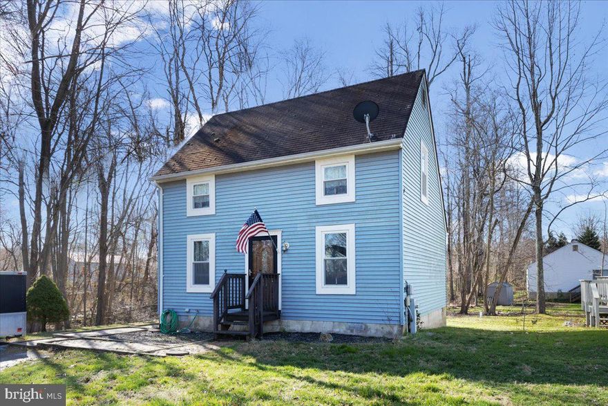 Looking for a good start? This is the perfect size home to begin your home ownership!  Three good size bedrooms, one on the main level and two upstairs that share a full bath.  Located at the end of the street and neighbors only to one side of you.  Good size level back yard.  There is a great back deck to enjoy the privacy and surrounded by trees . No city tax here as home is not in incorporated town of North Beach but you have very easy access to the neighborhood off of 5th Street and Madison Avenue.  Everything you need all wrapped up in a comfortable and charming floor plan just right to a first time buyer or someone who is looking to scale down.  Just a few blocks to the North Beach board walk, beach, restaurants and shops.  Priced in AS IS condition but everything is currently in good working order.