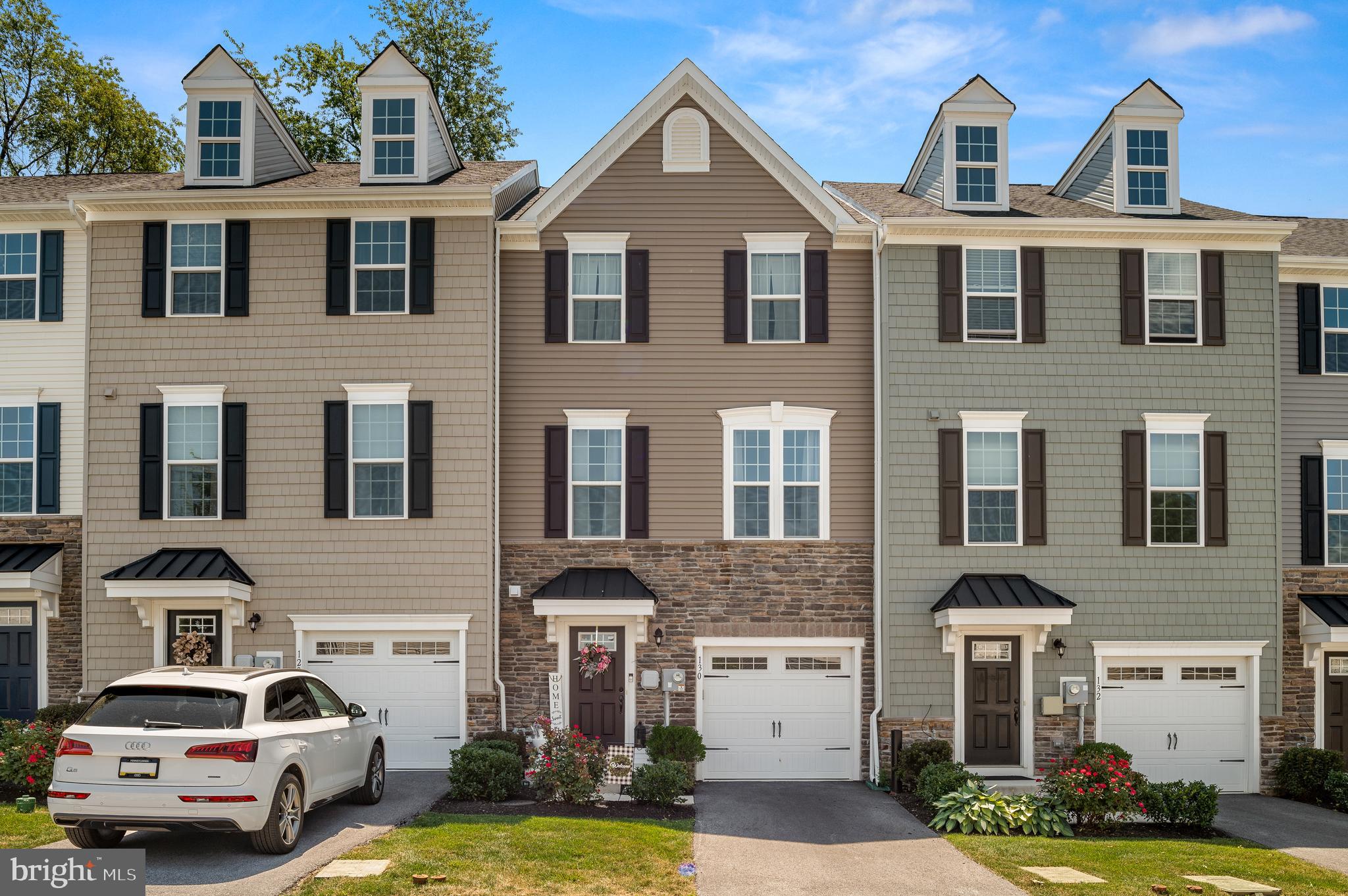 NEW PRICE FOR THIS TOWNHOME! Your next move just got even better - WELCOME to MALVERN! Step into comfort and convenience at 130 Mulberry Dr - this SPACIOUS open and flowing floor plan with 9 ft ceilings offers nearly 2,000 SQUARE FEET of living and provides lots of natural light through-out. Tucked into a neighborhood a with sidewalks and strolling trails minutes from Wawa and everyday essentials, this home is all about easy living with plenty of space to unwind and entertain! Hardwood floor greets you at the entrance of front door and private garage access. Bright open family room flex space with all NEW FLOORING with full access walk-out sliding door to backyard and half-bath complete lower level. On the main level, you will find a spacious gourmet kitchen with granite counter tops and stainless steel appliances (GAS COOKING!) opening to a bright living and separate dining area. Enjoy a meal outside on the DECK accessible from the kitchen. Moving upstairs you will find 3 BEDROOMS with ample closet space and full size laundry area. Primary bedroom suite features HUGE walk-in CLOSET, double sink vanity and shower with dueling shower heads. 3rd level has all new flooring. Great Valley Schools. If you are looking for a rental that offers space, style and a great location - YOU JUST FOUND IT! Minutes from West Chester, King of Prussia, Wayne, all major roads, shopping, dining and parks & trails. AVAILABLE IMMEDIATELY. Open house opportunities posted regularly for quick touring - Come wee why this one checks all the boxes. Call agent for further details.