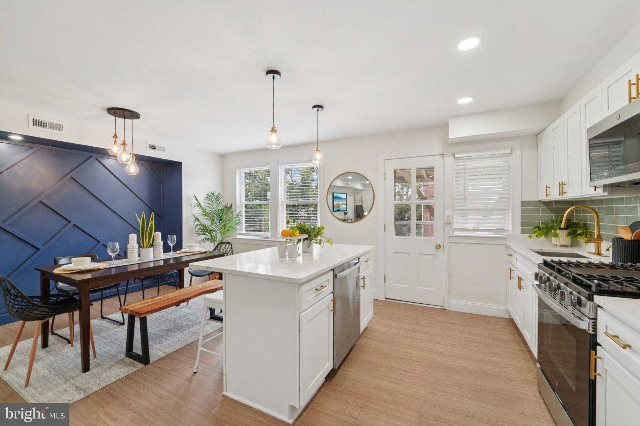 Welcome to this Beautifully Updated 3-Bedroom, 2-Bathroom home in Baltimore City’s Edmondson neighborhood! Thoughtfully Redesigned from top to bottom, this property features Modern Updates and Stylish Finishes throughout. Step inside to find Luxury Vinyl Plank Flooring, a striking Accent Wall, and an open concept Layout. The kitchen is a true highlight with White Shaker Cabinets, Gold Hardware, Brand-New Stainless Steel Appliances, and Modern Finishes—perfect for Everyday Living or Entertaining. Both bathrooms have been updated with Contemporary Design. Finished basement with walkout gives additional space to entertain or just relax. Stay comfortable year-round with Forced Air Heating and Cooling in Every Room. Outside, relax or host gatherings on your Brand-New Deck. On street parking or private parking in the backyard. This Move-In-Ready Home offers the perfect blend of Style, Comfort, and Convenience in the heart of Baltimore City.