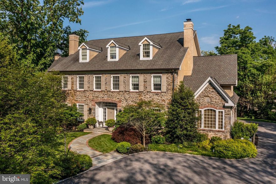 Welcome to 1400 Lanes End, a gracious Manor Home nestled in the coveted Harriton Farm neighborhood in Villanova. This sprawling residence covers an impressive 9869 square feet across four grandiose levels, offering six/seven spacious bedrooms, seven full and two half bathrooms.  Perfectly situated at the end of a cul-de-sac, the exterior grounds provide ample space for outdoor activities and privacy.  Inside, the home showcases the highest attention to detail, apparent in both the interior and exterior living spaces providing unsurpassed quality and craftsmanship.
Highlights include gleaming hardwood floors throughout the first floor, soaring ceilings, an elegant
staircase, chef’s kitchen with Wolf stove and range, Sub Zero refrigerator and freezer, butler’s pantry
with coffee bar, and a sunlit breakfast room. A formal living room, large, elegant dining room, a
private office, spacious mudroom, and a three-car garage finish the first floor. Floor to ceiling French
doors and windows overlook the grand patio and rear, well-manicured property.
The primary bedroom suite is a calming oasis with double-facing fireplace in both the bedroom and
sitting room, which opens up to a private balcony. There are dual dressing rooms and a sumptuous
primary bath with soaking tub. Each of the additional four bedrooms on this level have their own full
bathroom. The laundry room is also conveniently located on the second floor.
The third floor is fully-finished with a vaulted ceiling in the main space, with additional rooms
which can be used as bedroom(s) or studio space, and a full bath. The walk-out lower level is an
entertainer’s dream with wet bar, theater area, full bath, and ample storage space. Beautifully landscaped with mature trees and specimen plantings. Sprinkler system, generator, large three car garage with additional storage.  This home is a rare and exceptional offering in the heart of the Main Line.  By appointment only.