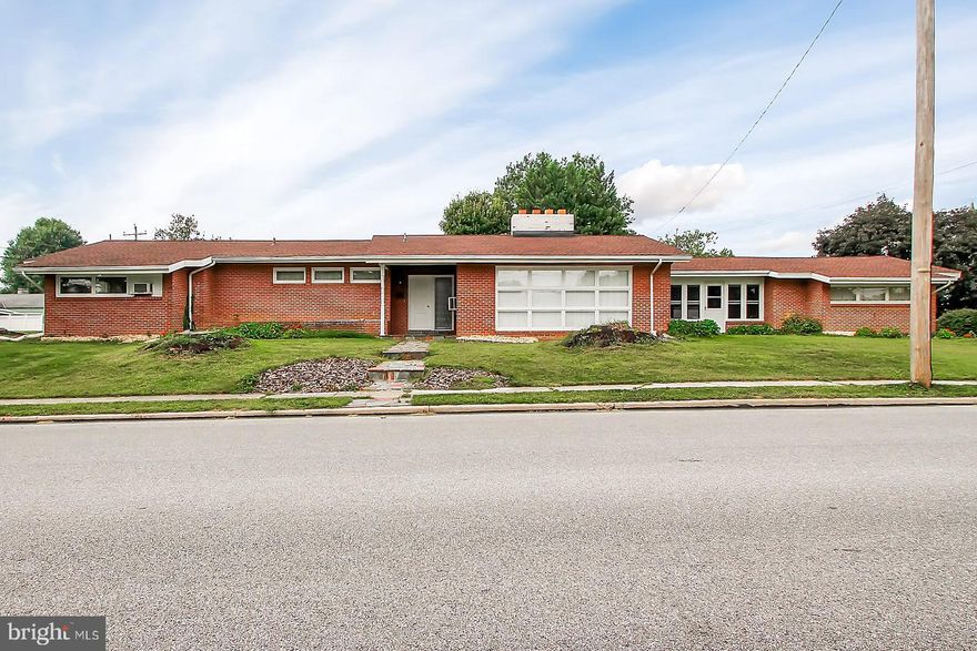 All brick Rancher situated on almost 1/2 an acre with over 2,800 finished square feet. Once inside, the flagstone foyer extends into the open living room which is accented with hardwood floors, custom built-ins and a wood burning fireplace. Enjoy your meals in the cozy breakfast nook located off the kitchen or entertain a bit more formally in the separate dining area, which contains a custom built-in china cabinet. Both the breezeway and lower level offer more livable space or can be used for storage. Convenient location to shopping and schools. Come see how you can make this house a HOME......