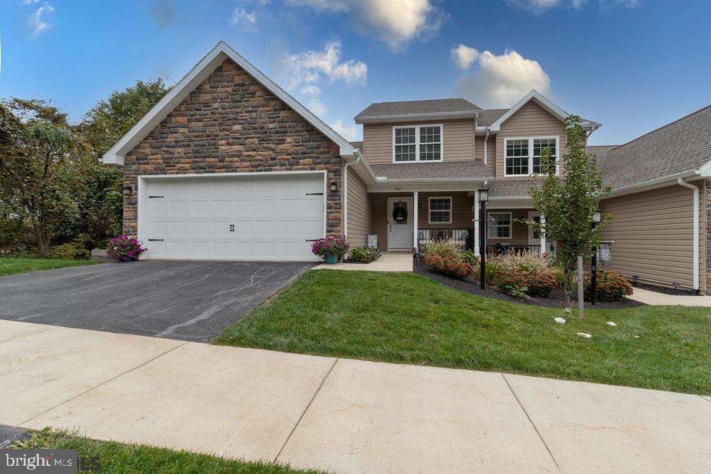 Lovely 3 bedroom, 2.5 bath townhome, with all the upgrades, located at The Mews in Bellefonte. This home offers an open floor plan, vaulted ceilings, central air, hardwood and tile flooring, lots of natural sunlight, and spacious rooms. The pristine maple cabinetry kitchen features soft-close cabinetry, under cabinet lighting, granite countertops, stainless steel gas appliances, and a large island. The living room includes a gas fireplace and sliding doors out to a nice deck to enjoy the views. The owner's bedroom is located on the main floor with a large full bath and walk-in closet. Upstairs, you will find two additional bedrooms with a full bath. The fully unfinished 1,000 sq ft walk-out basement is pre-plumbed for a full bath and has lots of room for storage. The lot offers privacy and amazing views with a tree-lined end lot and includes raised garden beds for the outdoor enthusiast. Just a short drive to State College and close proximity to I-99, shopping, and downtown Bellefonte.