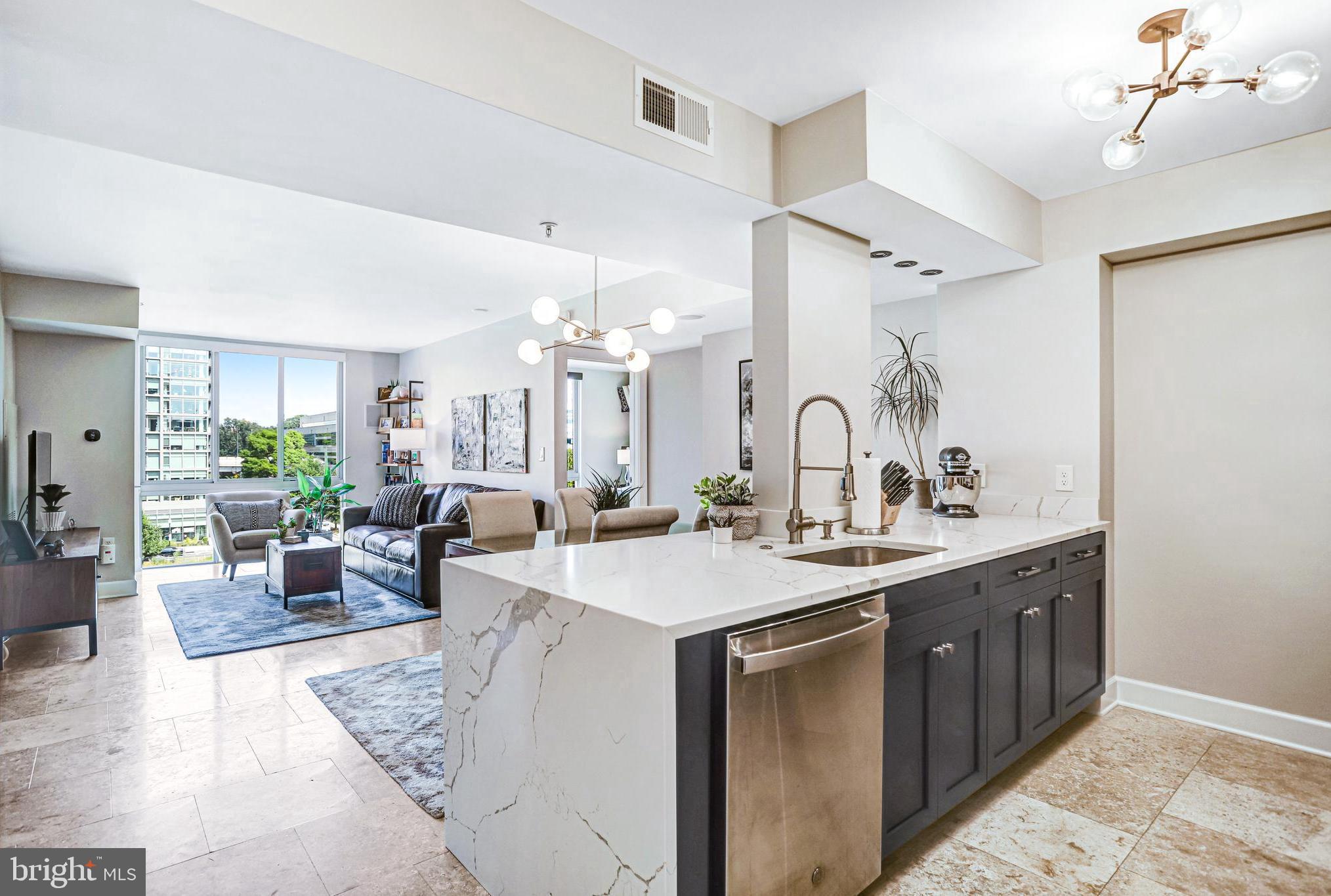 ***$138k of the List Price is already financed for you at a LOW 2.89% INTEREST RATE***. Welcome to unit 619 at Capitol Hill Tower, one of DC’s premier buildings in Navy Yard! Fully renovated in 2020, this meticulously designed 2 Bedroom, 2 Bath checks all the boxes and includes Garage Parking. The home features large floor-to-ceiling windows that flood the space with natural light, imported travertine stone flooring throughout, an open main living space, and designer fixtures & finishes. No detail was overlooked! The fully renovated kitchen features custom cabinetry with soft-close doors & drawers, soft-close roll-out shelving in base cabinetry, Calacatta Quartz countertops with waterfall edge and matching full height backsplash, stainless appliances, gas range, and separate pantry closet. The open kitchen overlooks the large dining & living areas, creating the perfect setting for entertaining guests! The Master suite features automated room-darkening shades, built-ins with additional hidden storage, an expanded walk-through closet with Elfa closet system, and beautiful en-suite bath. There's no shortage of storage in this unit with the massive 40sf walk-in closet inside Bedroom #2. The guest/main bathroom boasts a beautiful midnight blue vanity, and brilliant white quartz countertops. Enjoy convenient in-unit laundry with new LG front-load washer/dryer. Additional features/design details include Lutron Maestro & Decora light controls throughout (that fade on/off), built-in speakers for whole-home audio in main living area & both bedrooms, custom window treatments, elfa closet systems throughout, ecobee smart thermostat with remote sensors, smart/connected appliances, glass shower enclosures, quarts countertops throughout, Kohler & Moen bath fixtures, nest smart smoke detector, and so much more! Building amenities include 24-hour concierge, brand new Fitness Center, Indoor Pool & Spa for year-round enjoyment, beautiful resident lounge and club room for entertaining & relaxing, landscaped courtyard with water feature, gas grills and multiple dining/seating areas, On-site Sweetgreen Outpost, and complimentary Starbucks coffee bar. Renovations to resident hallways & common areas were recently completed, providing all the benefits and aesthetic of a brand-new building without the new construction premium! 1 block to Metro & Whole Foods, 2 blocks to Yards Park, H.Teeter, Vida, and countless restaurants and bars! One of the major benefits of Capitol Hill Tower in this market is $138k of the List Price is already financed for you by the Co-op at a ***LOW 2.89% INTEREST RATE***; you only pay/finance $517k! ALL PROPERTY TAXES are also paid through the Co-op ($289/mo). Total monthly payment to Co-op is $1,461 ($563 for Association Fee, $609 for mortgage payment (on the $138k), $289 for property taxes). NO RENTAL RESTRICTIONS for this Co-op aside from minimum 6-month lease! Only 10% down payment required. List price includes one parking license for the garage. A second parking license can be purchased from Seller for an additional $30k.
