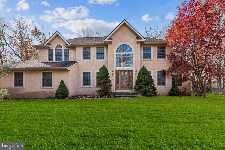 Welcome to 32 Constitution Drive
Nestled in the desirable Eagles Mere community, this stunning residence showcases the best of refined suburban living. Combining thoughtful upgrades, timeless architecture, and meticulous care, it stands proudly in one of South Jersey’s most sought-after neighborhoods.
Step into the two-story foyer, where abundant natural light highlights elegant crown molding and upgraded millwork throughout. The main level offers both functionality and sophistication with formal living and dining rooms, a private study (which can also serve as a fifth bedroom), and a dramatic two-story family room featuring a wall of windows overlooking the wooded backyard.
At the heart of the home, the chef’s kitchen boasts granite countertops, a stylish tile backsplash, and double ovens.  Recently updated.  The open dining area flows seamlessly to the expansive deck, perfect for effortless indoor-outdoor living and entertaining.  Newer sliding glass doors and front door. A convenient laundry/mudroom and an elegant powder room complete the main level.
Upstairs, the primary suite is a serene retreat with a sitting area, vaulted ceilings, and a generous walk-in closet. The spa-like primary bath features dual vanities, a soaking tub, a stall shower, and a private water closet. Three additional spacious bedrooms and a full hall bath with double sinks ensure comfort and convenience for everyone.
Outside, the property is framed by mature trees and professional landscaping. Enjoy the peaceful deck, tranquil stone water feature, and abundant space for entertaining or relaxing. The full finished basement offers incredible storage or the potential for additional living space, while the oversized two-car garage adds both practicality and versatility.
Expertly maintained by its original owner, this home represents a rare opportunity to own a residence with timeless design, thoughtful upgrades, and exceptional care. With geothermal heating and cooling, it offers both ecological and economical efficiency — the perfect blend of luxury and sustainability.