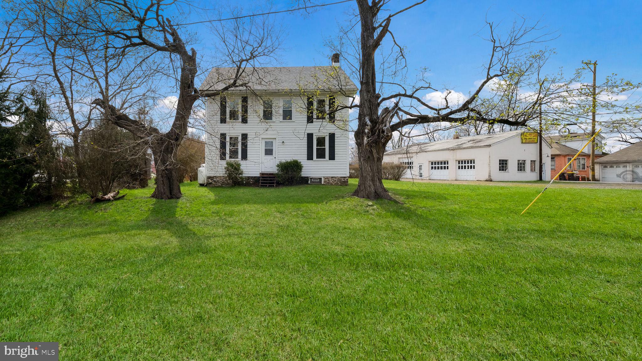 This Charming 3 BR, 2.5 Bath Colonial circa 1880 Combines Beautiful Millwork & Wood Floors from Days Gone by with a Modern, Professionally Updated Kitchen and Bathrooms. Talk about the Best of Both Worlds! A Large LR provides plenty of Room to Relax or Entertain while the adjacent Kitchen with Dining Area is the Heart of this Lovely Home. You will Enjoy an Abundance of White Cabinetry, Granite Countertops & a Laminate Plank Floor along with a Gas Stove, D/W & Extra Deep SS Sink. A Bonus Room keeps all of Your Options Open. A Playroom, Sitting Room or Craft Room can be Conveniently at your Disposal. The Back of the Home is Traversed by a Great Sun Room where Laminate Plank Floors & a Half Bath are present & you can step outside to a Wood Deck to enjoy your 1+Acre Corner Lot. Upstairs are 3 Nicely sized BR’s all with Wood Floors & Double Door Closets. The Owners’ Suite Includes a Full renovated Bath with a Tile Shower and Granite Sink overtop of an Upgraded Vanity. An Additional Hall Bath Offers a Tub/Shower Combination and Pretty Vanity as well. A set of Stairs leads the way to the Walk up Attic which is carpeted & provides more storage than you could ever hope for. Washer & Dryer Hook ups are found in the full unfinished Basement. Possibly one of the Biggest Bonuses of all is the Huge 30’ by 57’ Detached Garage with Ceiling Heights of up to 12’ and 4 Overhead Doors. The Village Commercial Zoning Opens up a Long List of Possibilities to Include an “In Home” Business Option or You can Occupy the Home & Rent the Garage or Rent Both. Last but Certainly not Least is the Amazing Location minutes from downtown Doylestown Borough and the Enchanting river Communities of Point Pleasant, Lumberville and New Hope. If you have Longed for an Interesting Property with Tons of Potential Make Sure to take a Look!