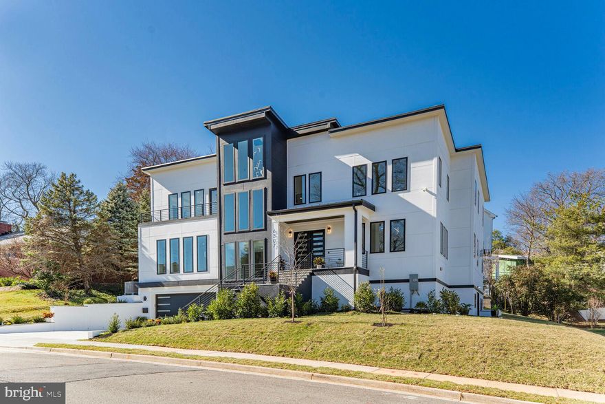 New construction! This home is ready for the most discerning of buyers. It features a contemporary style with generous room sizes, an excellent floor plan, 10' ceilings on all levels, and abundant natural light throughout!

The main level offers an expansive, open-concept floor plan with the kitchen, dining room, family room, sunroom, and entry foyer flowing seamlessly together. This level also features a butler's pantry, ample closet/storage space, a formal living room, a stylish designer powder room, and an office/bedroom with an attached full bathroom. 

The second level features the primary suite with a huge finished walk-in closet and a designer bathroom with a soaking tub, separate vanities, a huge separate shower with a bench and lots of water features, and a separate water closet with a bidet toilet. On this level are three additional large, well-appointed bedrooms, all with en-suite baths and walk-in closets. There are two large hall closets and a spacious laundry room with two sets of washers and dryers, a utility sink, and cabinetry.  There is also a lounge for comfortable, cozy reading with awesome natural light at the top of the stairs.

The basement features a gym, a mudroom with built-ins, a laundry room with a pet bath, ample storage, access to the 2-car garage (electric car charger ready), a bedroom with an en-suite bath and walk-in closet, and a spacious recreation room with a wet bar.

The home features stacked closets that are ready for a future elevator