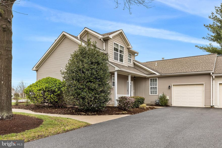 Don't miss this opportunity to own a rare York model in desirable Fox Hill Farm neighborhood, known for its unique layout and thoughtful design. From the moment you step inside, you’ll notice the airy feel created by dramatic two-story ceilings and an abundance of natural light streaming through skylights. The main level features beautiful hardwood flooring complemented by plush carpeting in select spaces, creating warmth and comfort throughout. On the main level the large living room showcases two story space and is open to the formal dining room. Beyond the dining room the large kitchen is completely open to a spacious area for another kitchen table, and the family room, all exposed to the bright light from skylights and the sliding door to the porch
The open living and dining areas flow effortlessly, making the home perfect for both everyday living and entertaining. A well-placed half bath on the main level adds additional convenience, while the one-car garage provides easy parking and extra storage. The thoughtful separation of living spaces makes this home feel both expansive and practical.

One of the standout features of this York model is the convenient main-floor primary suite. This spacious retreat offers two walk-in closets and a large en-suite bath, providing both functionality and privacy. Upstairs, a second bedroom with its own full bath creates the ideal setup for guests, a home office, or multi use space. 
Beyond the home itself, residents enjoy access to desirable community amenities that enhance everyday living. Beautifully maintained common areas, walking paths, and shared recreational spaces offer opportunities to relax and connect with neighbors. The community’s low-maintenance lifestyle allows you to spend more time enjoying the surroundings and less time worrying about upkeep. With its rare York model layout, the largest option of the carriage homes,  inviting interior features, and appealing neighborhood amenities, 203 N Silver Fox presents a truly special place to call home.