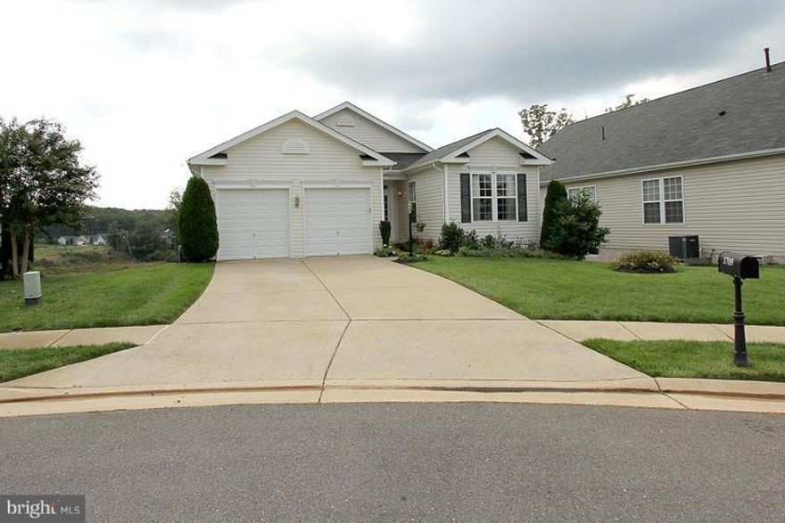 Absolutely charming very spacious open floor plan.This home features 2 levels,4 bedrooms & office/den,3 full baths,2 car garage,vaulted ceilings,hardwood floors,granite counters,ss appliances,improved fully finished basement has 4th br,office/den & full bath,storage room has built in shelves,nice view from deck overlooks homes and trees below, and so much more. 55+ community with all the amenities