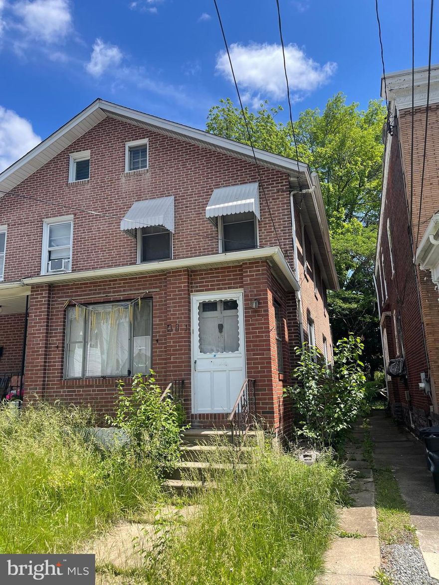 Investor Alert!! Great 3 bedroom brick twin with front and rear yards,  original hardwood floors throughout, enclosed front porch that would make a great mudroom,  needs a kitchen put in and some updating to make this a stunner.  Sold in as-is condition