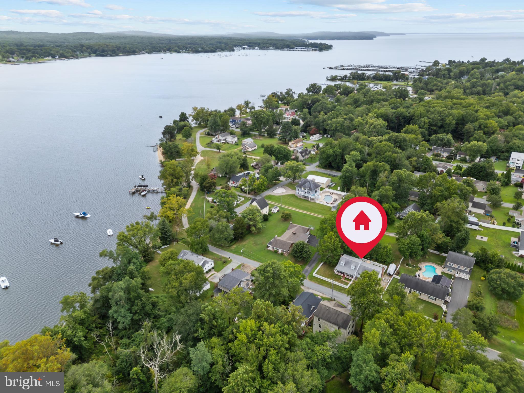 Welcome to 167 Bridgewood Ave, located in the desirable community of Charlestown Manor along the North East River, at the head of the Chesapeake Bay. This charming 3-bedroom, 2-bathroom home offers the perfect blend of coastal lifestyle and everyday comfort, with scenic water views and just a short walk to community water access. Here, new owners can enjoy the best of the Bay—boating, kayaking, fishing, jet skiing, and more—all with easy access to local marinas, waterfront dining, and charming small towns. The home itself features a welcoming front porch, a new fence and a brand-new deck, and convenient boat storage, making it an ideal retreat for water enthusiasts. Inside, the main level offers two comfortable bedrooms, a full bathroom, kitchen, dining area, laundry and family room with a cozy wood-burning fireplace, while the upper floor is dedicated to a spacious primary suite with an updated bathroom and walk-in closets. The home comes fully furnished and is move-in ready. A basement and 2-car garage provide excellent storage and versatility. The location offers the best of both worlds: a quiet waterfront community while being close to all the conveniences of the Upper Chesapeake Bay region, with its shops, restaurants, and entertainment. Spend a day of tax-free shopping at Christiana Mall, or explore Chesapeake City, the Elk River, Turkey Point Lighthouse, the C&D Canal, Havre de Grace and nearby marinas in North East, MD. Special touches include the ability to watch fireworks over the water throughout the year. And with Philadelphia International Airport less than an hour away and BWI about an hour’s drive, the home is an ideal weekend escape or full-time residence. Don’t miss the opportunity to enjoy riverfront living with all the benefits of the Chesapeake Bay lifestyle and beautiful scenic water views!
