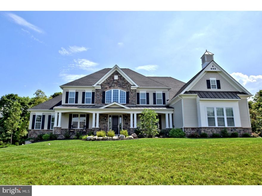 Located in Upper Makefield's most sought after and prestigious new construction community of Dutchess Farm Estates, this spectacular Toll Brother's Henley Farmhouse model sits perfectly on a premium lot backing to woods with gorgeous long distance views from the front porch and rear deck. Barely 9 months old, this property provides a timely opportunity for you to move right in to this now completely sold out 67 lot estate community. The stately Stone front/ Hardie Plank on all sides elevation with covered front porch is a classic for-the-ages look. The Henley is Toll's most popular floor plan and features a spectacular foyer entry with butterfly staircase. Impressive 10' first floor ceilings, detailed crown and box molding greet you upon entering, as well as beautiful hand scraped hardwood floors. To the left is a formal living room and spectacular conservatory with vaulted ceiling and walls of windows, to the right is the formal dining room. The impressive gourmet's delight kitchen features gleaming white 42" cabinets, giant center island that seats 4, and walk in pantry. Appliances include 42" Jenn Air French Door Refrigerator, Jenn Air 6 Burner Range w/Gridle & Double Oven, Jenn Air Wall Oven w/ Microwave and Jenn Air Dishwasher. Granite counters, gracious tile backsplash, triple sink window make this the most spectacular kitchen on the market. All of this is coupled with a huge, expanded breakfast room and triple French Door access to the Trex deck overlooking the rear yard & woods. The two story family room features a floor to ceiling stone fireplace and rear staircase. A formal office/library w/ magnificent custom built ins, giant mud room w/cubbies and plenty of storage space, powder room complete the first floor. The upper level features three bright and airy bedrooms all with private baths, and a fabulous Master Suite consisting of a large sitting room, main area with coffered ceiling, luxurious Master Bath with oversized shower, classic free-standing tub, his/hers vanities, huge walk in closet. Second floor spacious laundry makes for super convenience. The beautiful finished 40'x 40'lower level features natural light, gorgeous bar/kitchen with island seating for 4, media and game areas, full bath, ample storage, and walk out access to the paver patio in the ultimate privacy and tranquility of the rear yard. 3 car garage, 3 zone Heat/AC. Mint, move in, better-than-new condition. Just minutes to Newtown and New Hope Boro's, in the Council Rock SD.