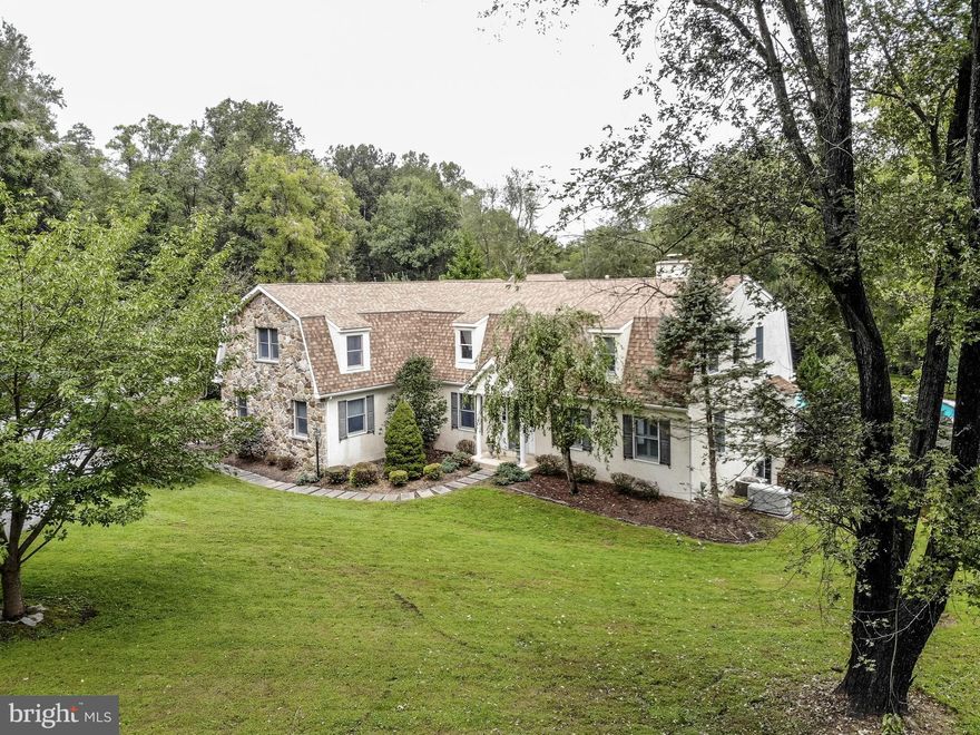 Set on 3.76 extremely private acres, sits this fabulous five-bedroom, three full bath, two half bath home located in a highly sought-after area and in the award-winning Unionville-Chadds Ford School District. You will love the stunning new Kitchen complete with handsome leathered black granite counters, high-end appliances, plenty of cabinet space, and a large pantry closet. Additionally, there is an area with an office and large bonus room that could be easily transformed into a wonderful in-law or guest suite. This wonderful space could enjoy its own outdoor access and remain private from the rest of the house. Further, this wonderful space would make a dramatic home office area if you have to work from home. You will love the magnificent master suite complete with a sitting area, two walk-in closets, a magnificent bath, and a huge bedroom. The beautiful Brazilian cherry flooring is located through both levels of the home. You will also love the stunning millwork in the dining room and around the fireplace in the family room. The in-ground saltwater pool is very privately located and easily accessed from the kitchen and breakfast area over a spacious Ipe deck by way of a large, new Anderson door. On the property is a large building that can house equipment or a large car collection you will never want for great storage space. The Lower Level features two Garage space and lots of storage. Off the Garage, area is a room that houses a horse stall and a closet for tack. Upstairs is a beautiful two-bedroom apartment that is rented for approximately $20,000 a year! This property is located in an area containing numerous equestrian farms and protected open space. The ChesLen Preserve, with its miles of hiking trails, is only five minutes away. This fine property is also convenient to major commuting routes, restaurants, and shopping.