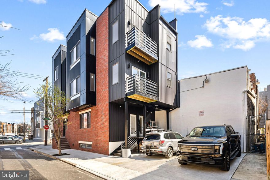 Luxury Corner Apartment in the Heart of Fishtown with Stunning City Views

Experience upscale city living in this extra-wide, designer 2-bedroom, 2-bathroom apartment, thoughtfully designed with modern elegance and premium finishes, located in the vibrant Fishtown neighborhood of Philadelphia.

Step into a bright and airy open-concept living space featuring custom-trimmed accent walls, overhead lighting throughout, and a stylish kitchen equipped with two-tone designer cabinets, matte black quartz countertops, a waterfall island, and premium Samsung appliances, including a built-in microwave. Pendant lights add a sophisticated touch to the kitchen, while the pantry provides extra storage for all your culinary needs.

Enjoy seamless indoor-outdoor living with a balcony off the kitchen, perfect for your morning coffee. The spacious primary suite boasts a double vanity, radiant heated bathroom floors, and a Bluetooth speaker in the shower for a spa-like experience. Two walk-in closets with custom organizers provide ample storage.

Additional features include central air and heat, full-size laundry, and a dedicated parking space. Security and convenience are top priorities, with exterior surveillance ensuring peace of mind.

Located in Fishtown, one of Philadelphia’s trendiest and most sought-after neighborhoods, you'll be steps away from top-rated restaurants, boutique shops, lively music venues, and cozy cafés. Enjoy easy access to public transportation, major highways, and the scenic Delaware River waterfront, making this the perfect place to call home.

Don’t miss this opportunity to live in one of Philly’s hottest neighborhoods—schedule your tour today!

Pics are representation of unit 3.  Very similar floor plan.  Listing agent to update photos on 3/1/25