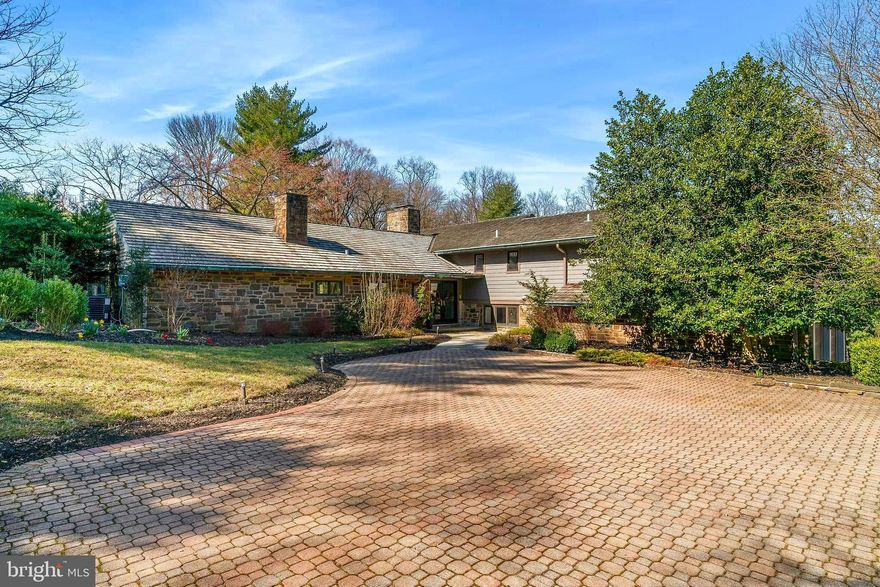 This is in Springfield Township MONTGOMERY County, PA.  Secluded splendor abounds from this gorgeous fully renovated contemporary home on 2.25 acres!  It's incredible location provides you with the best of of city life and suburban ease.  The majestic gated entrance is directly across from the beautiful Wissahickon Valley Park.  You are minutes away from Chestnut Hill with its cool boutiques and gourmet restaurants.  Center City is just around the corner offering all the best that Philadelphia has to offer!  Character exudes with the stone exterior dressed with copper gutters sitting on a stunniing park like lot.  Upon entering,  you will experience the feeling of bringing the outside in with open light filled rooms with walls of windows throughout.  This house is just over 4,000 square feet with 3 zones of heat and central air.  The floor plan is totally flexible.  There are 5 bedrooms all with ensuite spa like bathrooms.  One of the bedrooms is on the first floor and is currently being used as a yoga studio its ensuite includes a relaxing sauna. There are 3 lovely interior fireplaces.  The livingroom and lounge areas feature gorgeous wood vaulted ceilings custom wood work and trim.  The outstanding kitchen would please the most particular of chefs with its GE Cafe appliance suite including a 6 burner range, hood vent and wine refrigerator.  The huge center island and counters are made of quartz and framed with a carrera marble backsplash.  The kitchen is wide open to the ample sized great room.   It is an incredible space for entertainment overlooking spectacluar views.  The  multi level stone patio is surrounded by a scenic sanctuary. The first floor opens to an incredible covered patio with a vaulted ceiling and wood burning fireplace with a relaxing hot tub/spa. The upper level features 3 ample sized ensuite  bedrooms with spacious walk in closets, each with breath taking views!  There is a handy laundry room with a sink, and quartz counters.  The primary suite has a sitting area,  2 walk in closets,  water closet,  double sinks , and rain shower.  There is a heated attached 2 car garage.  All systems are new from 2020.  There are multiple intercoms and speakers and so many must see details  throughout!  This is not just a home, this is a true lifestyle experience!!!  This property is located in Springfield Township with a Philadelphia mailing for postal purposes.