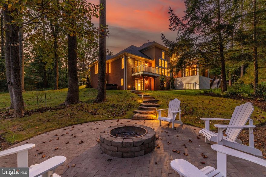 Wow, stunning estate home with main level owners suite featuring, 6,038 finished sqft of luxurious living space, set on a private 2.78-acre lot. From the moment you arrive, you'll appreciate the timeless brick exterior, curb appeal and the extensive upgrades that make this 5 bed, 4.5 bath home truly special. Inside, the home boasts a bright and open floor plan, featuring an upgraded KitchenAid 27" double wall oven, Wolf microwave, and modern finishes throughout. The screened porch overlooks serene landscaping and hardscaping, perfect for year-round enjoyment. The fully built-out home gym, complete with equipment, offers convenience and wellness right at home, while the hot tub provides the ultimate relaxation. Major improvements include a new roof with gutters and downspout covers, basement heat pump and condenser, water heater and kohler whole home standby generator.  Additional enhancements such as refreshed bathrooms, lush yard plantings, and upgraded fixtures elevate the entire property. With its blend of privacy, luxury, and thoughtful upgrades, this home is an exceptional opportunity. Don’t miss your chance to own this impressive retreat in a sought-after location!