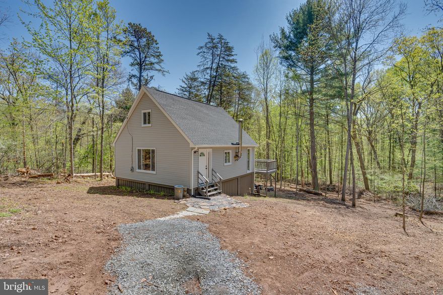 Escape to your own private retreat with this newly renovated cabin nestled in the heart of the countryside. Surrounded by nature's beauty and tranquility, this charming property offers the perfect blend of rustic charm and modern comfort. Recently renovated with meticulous attention to detail, this cabin boasts a fresh, contemporary aesthetic. The open concept living area is ideal for entertaining or simply relaxing by the fireplace after a day of exploring the great outdoors. The fully equipped kitchen features brand new appliances, ample cabinet space, and stylish countertops, making meal preparation a breeze. Retreat to one of the inviting bedrooms, each thoughtfully designed for maximum comfort and relaxation. Step outside onto the deck and soak in the breathtaking views of the surrounding countryside. Perfect for dining, stargazing, or simply enjoying the peace and quiet. Ideal for Investors as a vacation rental or year-round residence, those looking to downsize, nature lovers, or a weekend getaway from the city life. Don't miss your chance to own this slice of paradise in the countryside. Schedule a showing today and start making memories that will last a lifetime!