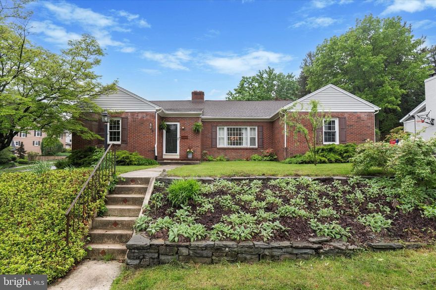 Set on a quiet corner in a charming part of Kennett Square Borough, this spacious ranch rambler home offers a warm and comfortable layout with room to grow, work, and relax. With four generously sized bedrooms, all with closets, and two full bathrooms, there's space for everyone—plus extra flexibility for a home office, workout area, or hobby room if not all bedrooms are occupied. 

Inside, you'll find hardwood floors throughout much of the home, and a bright, welcoming living room anchored by a classic fireplace and oversized windows that let the light pour in. The dining room feels open and airy, with double doors that lead straight out to the backyard—ideal for indoor-outdoor flow during the warmer months.

The kitchen is well laid out with solid wood cabinets, a center island with extra storage, and its own door to the yard, making summer grilling or weekend gardening a breeze. There’s also a bedroom currently being used as a family room/den tucked off to the side, featuring custom built-in shelving and storage that adds both function and charm.

The main bathroom is beautifully updated with a glass stall shower and stylish black-and-white tile. A second full bath, finished in classic blue tile with a tub-shower combo, serves the other bedrooms.
All four bedrooms are roomy—especially the oversized primary—and offer plenty of options for guests, kids, or simply spreading out.

The unfinished basement offers lots of storage and houses the laundry area. There’s also a full attic with a built-in cedar closet. Outside, the fenced-in backyard is private and peaceful, with a mix of mature trees, a shed for your tools or toys, and a patio that's perfect for entertaining or relaxing outside.

This is a home with great bones and room to make it your own, in a walkable and friendly neighborhood just steps from the center of town, Anson B. Nixon Park, the new library, the YMCA, and dozens of shops and restaurants.