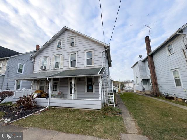 Discover the potential of this spacious semi-attached twin home in Northampton County, Pennsylvania. Offering over 1,200 square feet of living space across 2.5 stories, this residence features a combined living and dining area, a functional U-shaped kitchen with side yard access, and a convenient powder room on the main floor. The second level includes two bedrooms, a full bathroom, and an additional versatile room suitable for an office or recreational space. The partially finished attic provides extra room for a third bedroom or creative use. The expansive rear yard, complemented by a large detached garage suitable for vehicle storage and more, enhances the property's appeal. With its proximity to local amenities and parks, this home presents a unique opportunity for customization to suit your lifestyle.