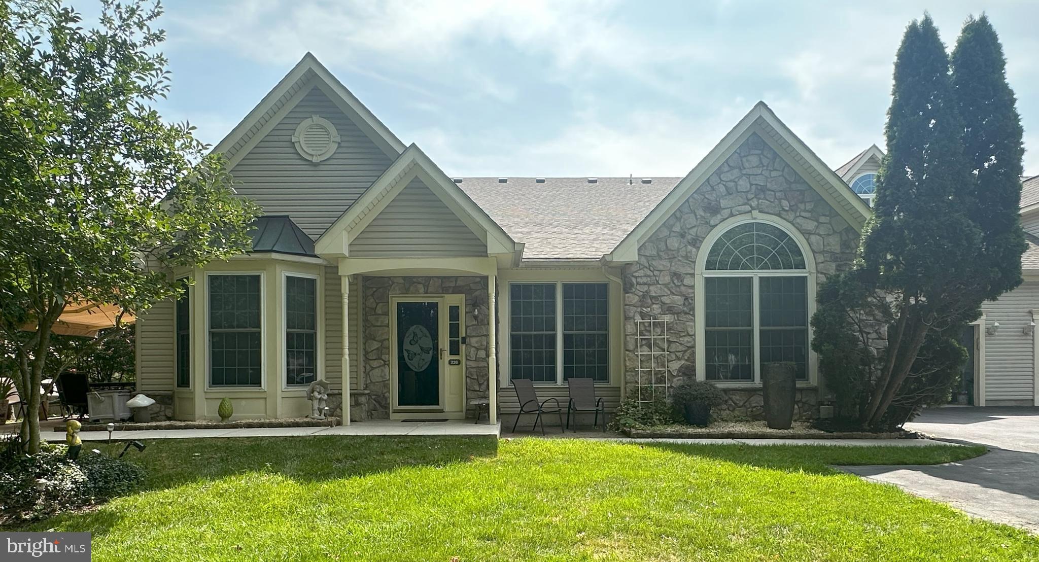 Welcome to this exceptional home in the vibrant 55+ community of Flowers Mill! This thoughtfully designed residence features 2 bedrooms and 2 full bathrooms, including a generously sized primary bedroom with ample space for relaxation. The inviting interior boasts vaulted ceilings and a seamless flow from the well-equipped kitchen—complete with a large pantry—into a spacious dining room, ideal for hosting family and friends.

The second-level loft offers versatile space for your needs, with convenient access to attic storage for added convenience. The laundry room, complete with a small mud room, ensures practicality and ease of use.

Step outside to enjoy your private outdoor oasis under the patio awning, perfect for relaxing or entertaining. The two-car garage provides not only secure parking but also valuable storage with its sealed flooring. 

Flowers Mill offers a wealth of amenities to enhance your lifestyle, including indoor and outdoor pools, tennis and pickleball courts, a fitness center, scenic walking trails, and a grand ballroom for community events. Discover the perfect blend of comfort, convenience, and community in this lovely home. Welcome to Flowers Mill!