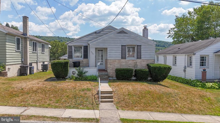 Tucked on a quiet street near the northeast edge of town, this lovely ranch home is just waiting for you to make it yours. The cozy front porch leads into a welcoming living room which gives way to a central hall. Three lovely bedrooms line the hall; a cedar closet an exciting feature of the front bed, while front and rear beds show the lovely original hardwood floors! A full bath and large hall closet sit just before the home’s eat-in kitchen with ample cabinetry, space aplenty to create and gather! A heated sunroom opens to the rear deck, both overlooking the flat, fully fenced yard and capturing the southern views of wooded hills beyond! Yard bonus, a 25x10 covered concrete pad ready to serve as car-port or back yard pavilion! The home’s basement begins with a sprawling finished family room, complete with wet bar! Beyond, abundant space for utilities, storage and laundry. The basement is a walk-out to the back yard, the door leading up to a concrete pad beneath the deck, while a built-in shed is conveniently placed beneath the sunroom. Lovely and thoughtful use of space paired with tremendous potential make this home a must see,  inside and out! While at the edge of town, the home offers easy access to Tamaqua’s growing downtown, as well as routes 309 and 209. Bonus, situated in the Tamaqua School district where graduates qualify for the two-year LCCC Scholarship!