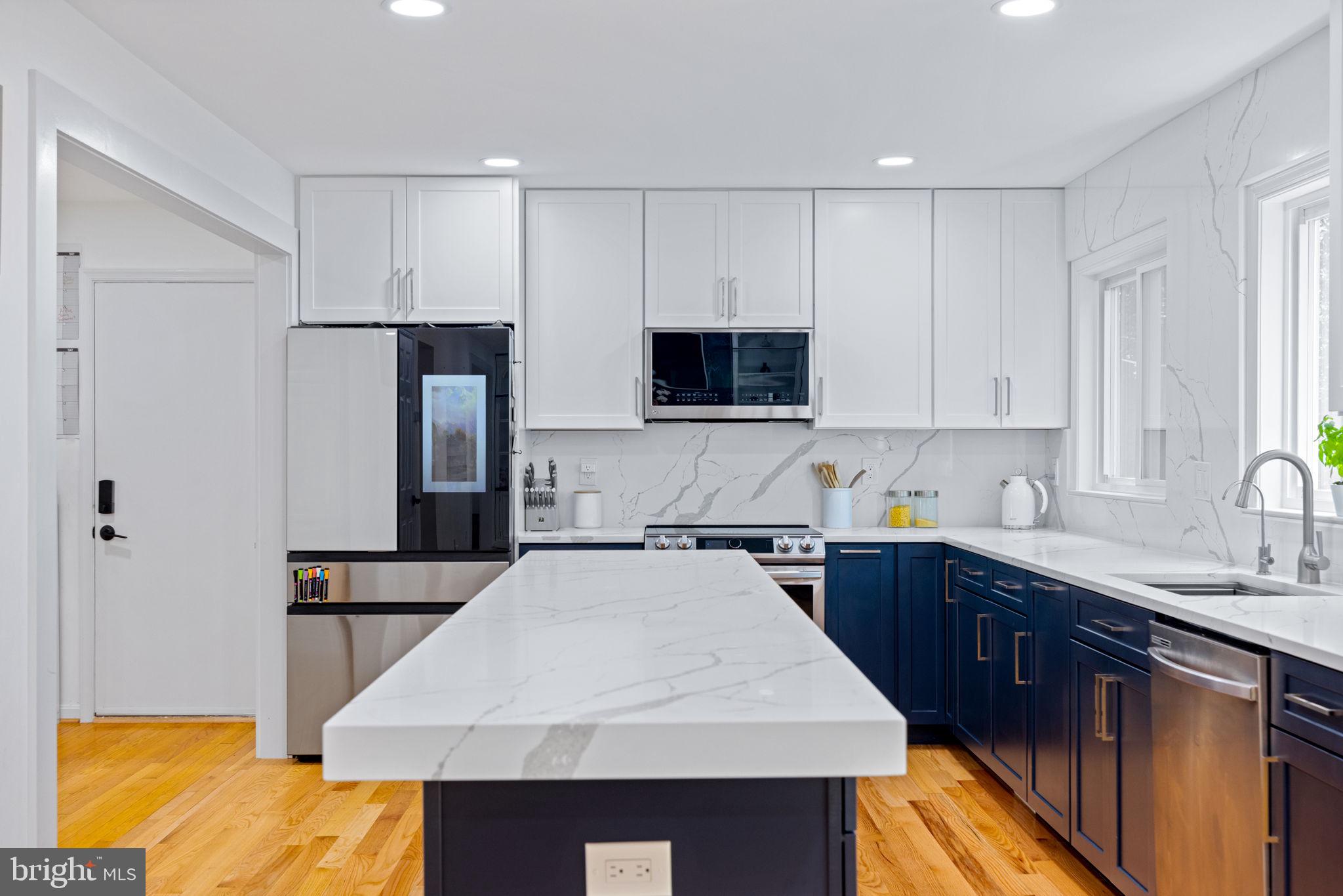JUST REPRICED TO MATCH THE MARKET. This is a Relocation sale. Don't' miss this rare opportunity to own a move-in ready gem in Reston's most sought after cul-de-sac. Modern finishes, open layout, and unbeatable location . Welcome to 10809 Dayflower Ct — where comfort, style, and smart design come together beautifully in the heart of Reston. Step inside and you’re immediately greeted by gleaming hardwood floors and sun-filled spaces, thanks to an abundance of windows that bathe the home in natural light. The main level has been transformed with an open-concept layout—walls removed to create seamless flow and connectivity between living areas. The cozy sitting area features vaulted ceilings, skylights, and custom lighting, creating the perfect atmosphere for relaxed mornings or peaceful evenings. The FULLY RENOVATED GOURMET KITCHEN is truly the heart of the home, showcasing quartz countertops, a stylish backsplash, custom two-tone soft-close cabinetry, and smart stainless steel appliances, including a Samsung Bixby smart oven and a Samsung refrigerator with AI Family Hub.
Adjacent to the kitchen, the generously sized mudroom cleverly incorporates a front-load washer and dryer—beautifully integrated without sacrificing any space—and leads directly to the 2-car garage. The spacious family room features a charming bay window, built-in shelving, and a striking floor-to-ceiling marble fireplace, all enhanced by recessed lighting throughout. From here, step out onto a large deck overlooking lush, tree-lined views—your own private outdoor escape.
Upstairs, you’ll find four spacious bedrooms and two beautifully updated full bathrooms. The lower level expands your living space with a full bathroom, a wet bar, finished storage, and a utility room with a built-in workbench—ideal for hobbies or home projects.
Additional highlights include Govee exterior light system that is professionally installed for Christmas, Halloween and Birthday parties, a radon mitigation system, whole-house water treatment system, providing clean, filtered water from every tap—a rare and valuable feature and nearly new appliances (just 8 months old), including the washer, dryer, and dishwasher and brand new carpet in the. primary bedroom.
Located in a sought-after North Reston neighborhood with easy access to Metro, shopping, dining, and commuter routes, this home also comes with access to Reston Association’s exceptional amenities—including several outdoor pools, 55 miles of walking and biking trails, several tennis and pickleball courts, multiple lakes with boating access, parks, picnic areas, sports fields, community centers, and a vibrant calendar of events and programs for all ages.
This home is not just move-in ready—it’s ready to be the start of your next chapter in one of Northern Virginia’s most dynamic and nature-rich planned communities.