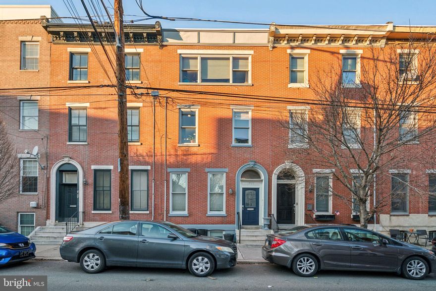 Stately brick front Victorian townhouse completely renovated as a Duplex, two unit home in the heart of the vibrant Francisville neighborhood.  Consisting of a 2BR, 2ba bi-level unit on the lower two floors and a 3BR, 2 1/2ba bi-level unit on the upper two floors.  The ideal property for an investor to make strong rental income in a bustling neighborhood or an owner-occupant looking to live in one unit and earn rental income from the other! This beautiful property, fully renovated with modern finishes offers the perfect blend of comfortable living and investment potential. From a small shared vestibule, enter the first-floor unit featuring high ceilings, tall windows with south facing sunshine, hardwood floors, and recessed lighting throughout. The spacious open plan living and dining room leads into a sleek kitchen with granite countertops, stainless appliances, and a breakfast bar. A door next to the kitchen offers access to the generously sized patio, perfect for outdoor gatherings, container gardening and can be used as off-street PARKING! The main bedroom and bath are just beyond the kitchen. This unit also includes in-unit stackable laundry. Downstairs, the finished basement makes for the perfect lounge and entertainment space, and has a privacy door so it can be used as the second bedroom, with access to a full bathroom and additional storage. The larger, second-floor unit is a 3-bedroom, 2.5-bathroom bi-level apartment with hardwood floors, central air, and a private back deck off of the kitchen which overlooks the back yard. The open kitchen includes stainless steel appliances, a gas range, and a pantry, leads up a few steps into a spacious, open living and dining area perfect for entertaining. Upstairs, the primary bedroom boasts three oversized south facing windows and a lux en-suite bathroom, while the two additional bedrooms share a full bath off of the hall. The entire building comes with 1-car PARKING, adding extra value to this already exceptional property. Located just blocks from Fairmount Ave, local shops, restaurants, and attractions like the Art Museum district, Eastern State Penitentiary, access to the Center City business corridor and all that an urban lifestyle has to offer. This duplex offers a fantastic opportunity for investors or owner-occupants looking for rental income in a vibrant, high-demand area, come see it today!
