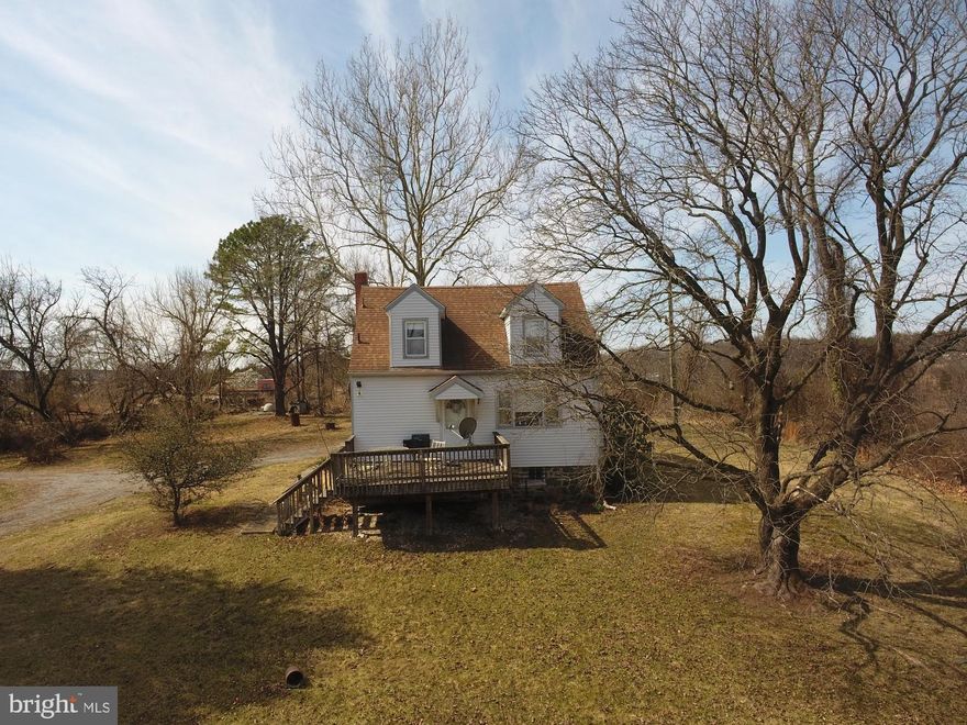 Incredible opportunity for investors, builders, or homebuyers! This 3-bedroom Cape Cod sits on 3.8 acres along a private drive with picturesque valley views.  The home needs TLC but offers great potential, featuring a solid stone foundation, original hardwood floors, and classic charm. Zoned DR1 which may allow for two additional homes (buyer to verify with county). Enjoy a unique setting that borders both scenic farmland and hiking trails while being just minutes from major business centers and transportation hubs. Adjacent property (owned separately) is available. Property subject to a deeded 20' Right of Way. Sold As-Is.