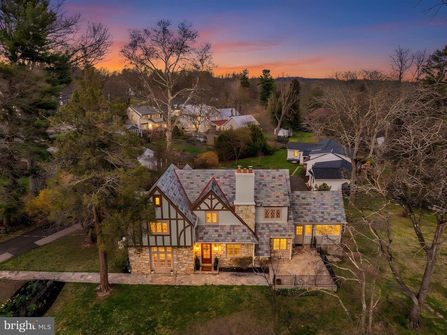 Tucked along a private lane on coveted Golf View Road in the heart of Doylestown Boro, this storybook Tudor is a rare and special offering - where timeless architecture, exceptional setting, and rich history blend together beautifully. Set on .6 acres of lush, picturesque grounds, mature landscape and inviting stone patio spaces create an enchanting outdoor setting perfect for both entertaining and everyday enjoyment. Built in approximately 1930 and lovingly maintained by just 3 families in its lifetime, this special home is filled with warmth, character, and enduring charm. A gracious Foyer welcomes you into sun-filled spaces with hardwood floors and a flowing layout. The formal Dining Room, lined with oversized windows, is ideal for gatherings, while the expansive Living Room features a gas fireplace with Mercer tile accents and serene views. The Kitchen offers granite countertops, abundant cabinetry, a butcher block butler’s pantry, and a sunny breakfast area. A cozy, spacious Den with built-ins lends itself to a Sitting Room or Home Office, and a stunning all-season Sunroom with stone floors and walls of windows provides a beautiful, flexible living space that opens to the expansive patio and backyard. Upstairs, charming, curved banisters, hardwood floors and an open landing leads to the private Primary Suite with stunning windows, two closets (one with access to additional floored storage), an updated Bath with walk-in shower and a convenient built-in Washer/Dryer. Three additional bedrooms and a spacious Hall Bath complete the level, with charming Tudor details throughout. Additional highlights include a full Basement with convenient bilco doors and additional laundry area, floored attic spaces, exterior-access storage, and a whole-house generator. Just a short stroll to Doylestown’s shops, restaurants, and museums, this home offers a lifestyle as exceptional as its setting. A truly timeless property - full of character, beauty, and the promise of lasting memories. Welcome to 24 Golf View Road,  a home that will inspire the next pages of your story.    Showings begin Tuesday, April 7th
