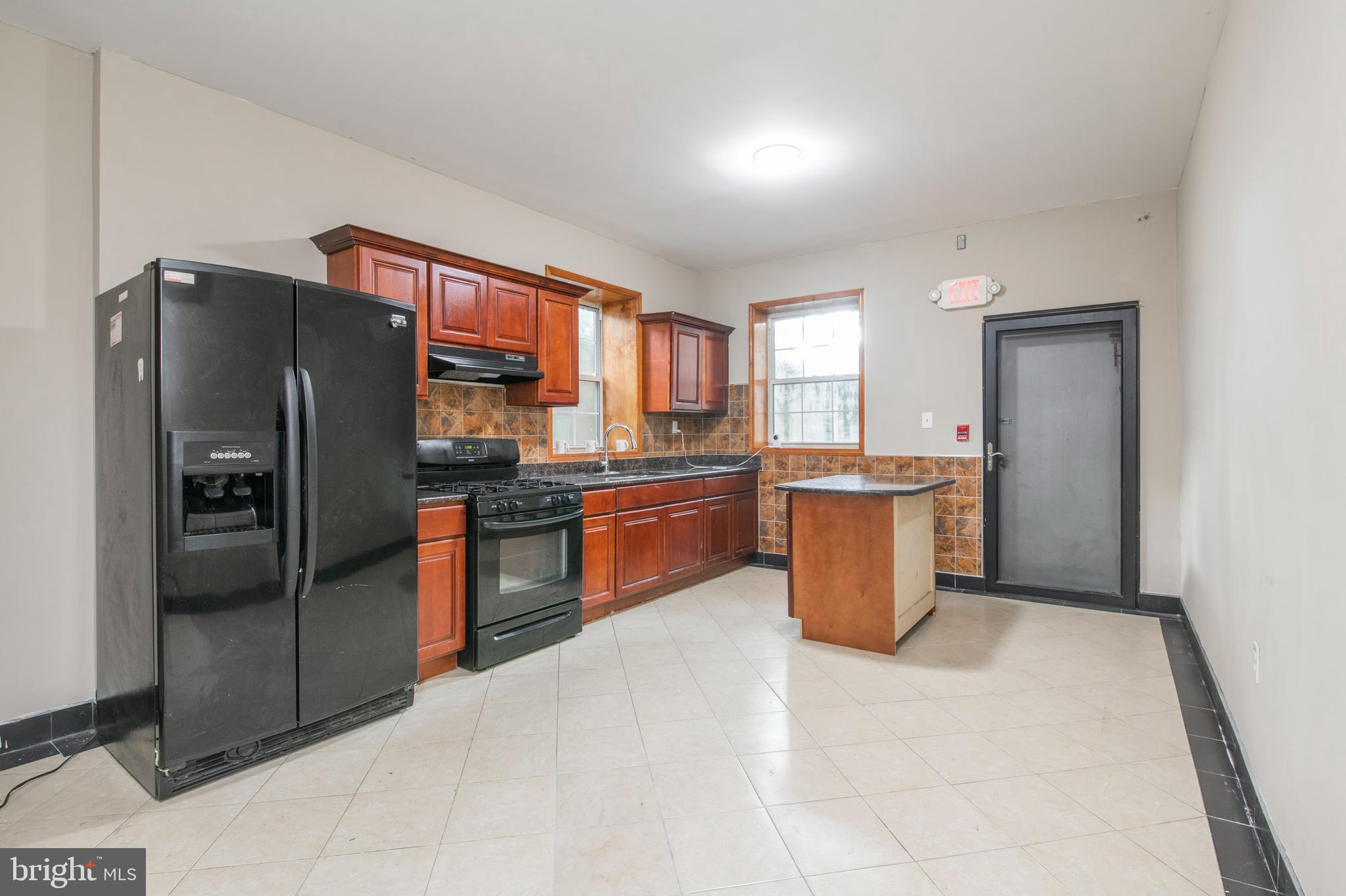 Beautifully updated first floor apartment with HUGE private yard! Has been powerwashed since photos, new photos coming soon. Located in the rear of the building, this unit is private and secluded with your own backyard oasis with tons of potential. Rent INCLUDES gas, electric, and water! Unit has tiled floors and modern updated kitchen and bath. Building has on site shared laundry just steps from your unit for convenience. Built in air conditioning and you control your heating individually. No pets and no smoking. Great location on the same block as the Broad Street Subway Line for a quick commute to center city. Walk to all the neighboring neighborhoods have to offer - Fairmount / Art Museum and Northern Liberties / Fishtown. Student friendly with cosigner - walk to TempleUniversity just blocks away. Available for immediate move in. Three month's rent due to move in - first, last, and one full month's security. Subject to credit, criminal, and eviction background check and verification of income. Rent INCLUDES gas, electric, and water!