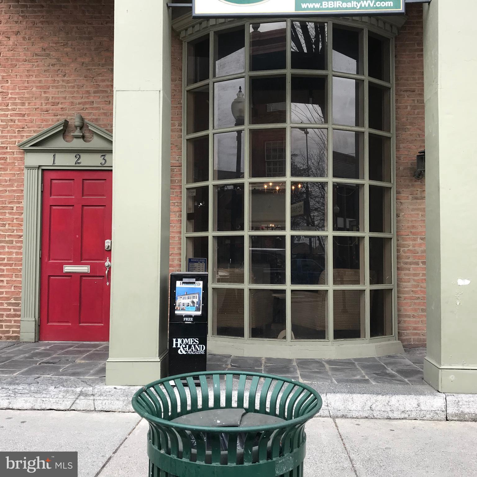 Half block from Town Square. here's a Main Street building with so much potential. 3 floors with 2000 square feet per floor, huge picture window in front, hardwood floors, steps to a "stage area"... Basement has 2 large rooms for conference room or office. Attic is unfinished and has 2 separate entrances from main level and basement. Contact today for more details