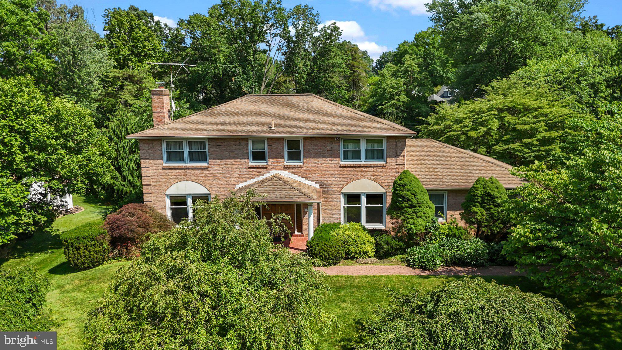 Custom Pat Sparango Colonial in Springfield Township School District
Step into timeless elegance in this beautifully maintained, custom-built Pat Sparango center-hall colonial, ideally located on a quiet cul-de-sac within the sought-after Springfield Township School District. One of only 10 homes on the street, this special property offers rare privacy and a true neighborhood feel.
A welcoming brick paver walkway leads to an impressive double-door entrance. Inside, you’ll find spacious, light-filled rooms that reflect the home's classic charm and thoughtful updates. The formal living room features a cozy gas fireplace, while the elegant dining room is accented with crown molding and chair rail detailing—perfect for gatherings and special occasions. Throughout the home, neutral wall colors provide a clean, move-in-ready backdrop—offering the new homeowner a fresh canvas to decorate to their taste.
The eat-in kitchen is a chef’s delight, offering Corian countertops, ceramic tile flooring, rich wood cabinetry, and top-tier appliances. A built-in banquette seating area adds charm and functionality, while a built-in desk area, located opposite the greenhouse but still part of the kitchen, provides a convenient spot for managing household tasks or working from home. From the kitchen, step into a stunning greenhouse addition with floor-to-ceiling windows and skylights—ideal for enjoying natural light and garden views all year long. The greenhouse offers direct access to either the rear deck or a side patio, making indoor-outdoor living seamless.
The main level also includes a large den with newer sliding doors that lead to the expansive deck with built-in bench seating, perfect for entertaining. A convenient half bath is located off the kitchen and den area.
The first-floor laundry room offers inside access from the oversized two-car garage, which features an automatic garage door opener and keypad—perfect for coming and going in bad weather. From the laundry room, you can enter directly into the kitchen for added ease and functionality. The garage also includes built-in storage shelves.
Upstairs, the spacious primary suite features a dressing area with a sink and vanity, multiple closets, and a private ensuite bath—offering comfort, convenience, and plenty of storage. Three additional generously sized bedrooms and an updated hall bath complete the second floor.
The very large finished basement adds tremendous living space and flexibility, including a space that can be used as a small private office, a utility room, and abundant storage—ideal for keeping everything organized and out of sight.
Additional highlights include gleaming hardwood floors, professional landscaping, and key system upgrades such as newer windows, HVAC, and hot water heater.
Located just minutes from major highways, this home offers both convenience and serenity in a peaceful residential setting. Classic design, modern comfort, and exceptional space—this one-of-a-kind home has it all.
Don’t miss your opportunity to make it yours!