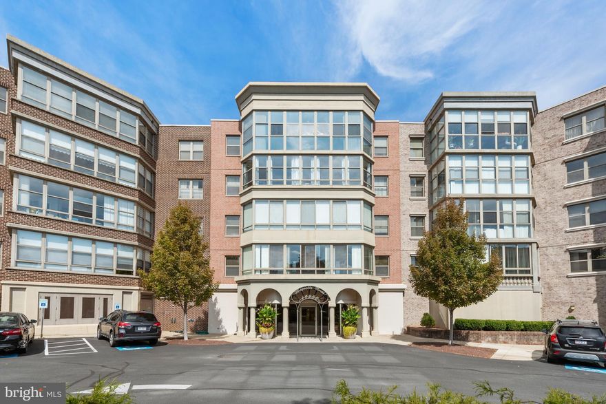 Enjoy condo living in this beautifully updated 2-bedroom, 2-bath home in Lansdowne Woods. This 4th-floor unit features a bright open floor plan with a large glass-enclosed sunroom offering year-round enjoyment. The spacious kitchen opens to the dining and living area, perfect for entertaining. The primary suite includes a large closet and private bath, while the second bedroom is ideal for guests or a home office. Includes indoor garage parking (space #5-001) and a private storage unit. New furnace in 2021. Enjoy resort-style amenities including an indoor pool, fitness center, clubhouse, restaurant, and more—all in a secure 55+ community minutes from shopping, dining, and medical facilities.