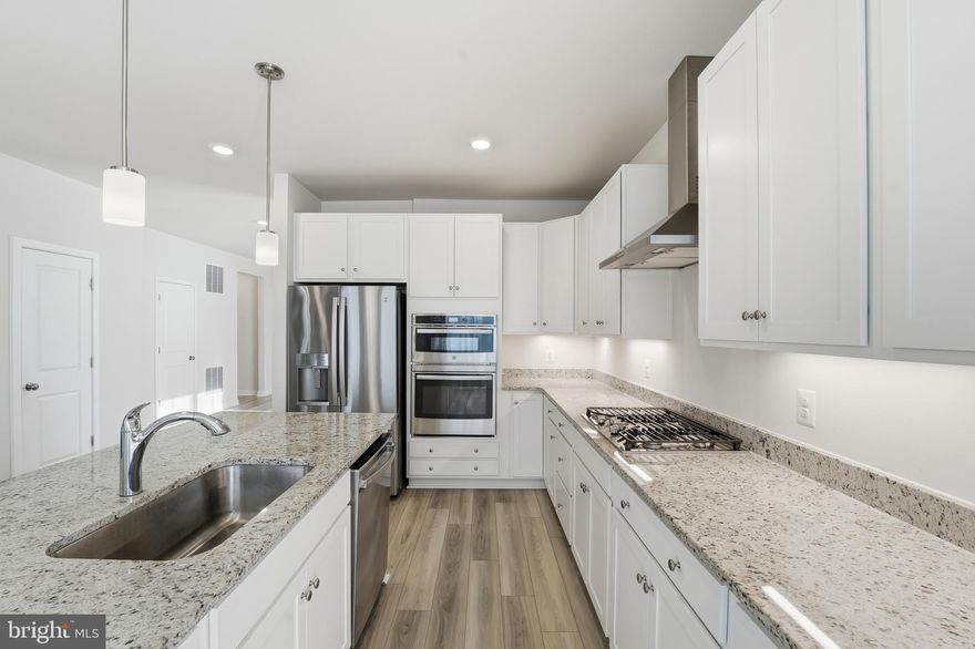 AVAILABLE FOR SHOWINGS JAN 1! Give yourself the gift of an immaculate home this holiday season! Built in 2023, this like new 4 bed/3 bath home on a corner lot has so many incredible features. Do you like LOW power bills and main level living? Well, then, this is the home for you! Everything you need is on the open and spacious main level with nine foot ceilings throughout. The open concept main level is home to three bedrooms and 2 full baths, a gourmet eat in kitchen located off the family room and a separate dining area for entertaining. For the chef in your family there is a large island, plenty of counter space for prep work, a gas 5 burner cooktop, along with a convection oven and built in microwave. Recessed lighting along with under cabinet lighting and the lighted hood add just the right amount of lighting needed to prepare your feasts. Snuggle up by the gas fireplace or step out the back glass door down your lighted steps to your stamped concrete patio for grilling and entertaining as well.  You can store your garden tools in the shed or turn it into a she-shed or play house. Thoughtfully built on a concrete pad to keep things neat and tidy. The lower level has a legal bedroom with walk in closet and a full bath along with a large rec area. Storage won't be a problem with a sizeable kitchen pantry, large walk in closets in master and lower level bedrooms and a separate Large storage area with space for a gym or office on the lower level. Solar panels, that you will own, keep your bill to a minimum with just a monthly connection fee. Your agent can see recent bills in documents. The seller has added all the special touches to keep this home well maintained. A water softener system that is owned, not leased. A 500 gallon propane tank for cooking and heating, a Ring doorbell and SimpliSafe security system, Epoxy flooring in storage area just to name a few. This home is top notch in every way and will sell fast so schedule your showing today!