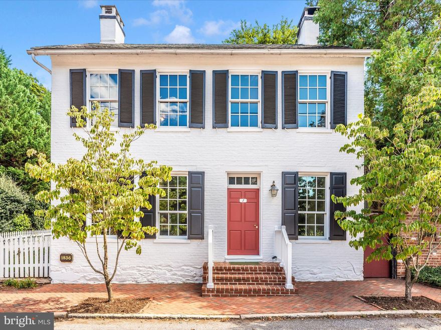 Discover 7 West Main Street, a Georgian-Federal home beautifully blending 21st-century conveniences with 19th-century elegance. 
The home is ideally situated for modern life: blazing-fast Comcast internet (last measured at 475 Mbps), minutes from MARC commuter rail, and close proximity to Frederick.
In addition to the specifications provided below, the property boasts a 648 square foot, 4-room ADA-compliant carriage house. Built in 2005 with a 2023 full bathroom addition, this versatile structure is ideal as a home business, in-law suite, or a revenue-generating rental property, with local AirBnB rates from $612-$892/week in this popular tourist destination. Combined, the main home and the carriage house offer 3,200 square feet of living space.
Inside, enjoy historic details like heart pine floors and original Federal fireplace mantles. Modern updates include a 2023 heat pump and fully modernized electrical and plumbing. Energy-efficient double thermal pane windows retain their 19th-century appearance. All three first-floor fireplaces are functional—two are wood-burning and the third outfitted with a Vermont Casting wood stove.
If you’ve ever wanted to experience life on an honest-to-goodness “Main Street, USA”, you’ll feel at home in this 1836 residence, complete with its own white picket fence.