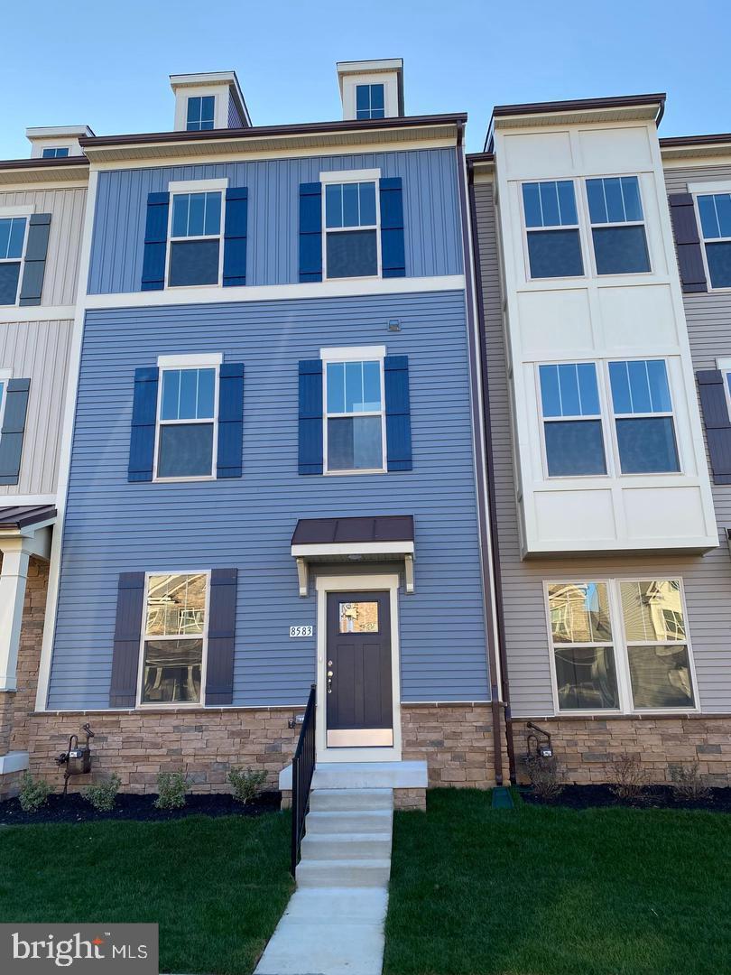 Welcome to this Two year old well maintained 3 -story 2 car garage townhome in the newest community within the Villages of Urbana. Never lived in. , built by Dan Ryan, 3 bedrooms, 3.5 baths, 9ft ceilings, Basement with bed room and full bath. parks, a brand new resort-style rec center/pool, grocery, shopping, restaurants, library, YMCA and more. The main level with hardwood flooring boasts a spacious multi-functional room with direct access to the the deck .Bright kitchen with 42' soft-close cabinets, Granite countertops, stainless steel appliances, . Enjoy plenty of space for larger gatherings and dining, and open concept living area. The 3rd level boasts a large owners suite with walk-in closet, private bath, 2-sink vanity shower, 2nd and 3rd bedrooms, 2nd full bathroom and laundry room. Community offers tennis courts, farmers market, biking/hiking trails. HOA includes everything plus trash/recycling, lawn maintenance, snow removal, and pool passes. Commuter friendly neighborhood with easy access to 270, downtown Frederick, Baltimore, DC.