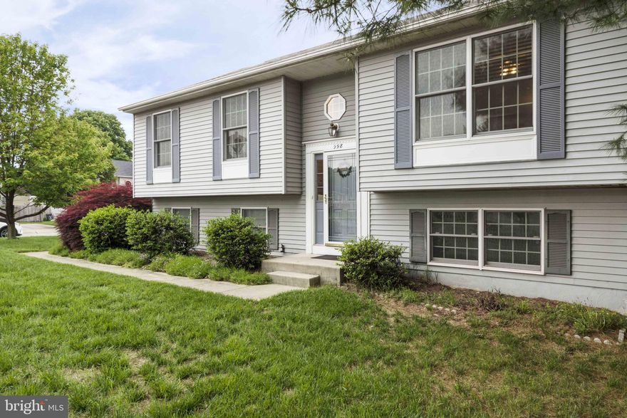 Well cared for home in amenity rich Harting Farm. Located on a large corner lot with fencing, landscaping, and parking for multiple cars.   An outdoor deck off of the kitchen for easy outdoor meals or relaxing.   Upstairs you will find 3 bedrooms and 2 full baths.  There are living/family room spaces on both levels for entertaining options.  Carpet and Paint in 2019 so that you can move right in!   The lower level also offers a large unfinished space for storage or potentially another future bedroom.  Located conveniently to Annapolis, Baltimore and Washington.  There are restaurants and county parks nearby.   The community amenities include outdoor pool, clubhouse, walking paths and tot lot.   Here are some of the updates the Seller has already done for you!  2003 - Exterior fence,  2005 - Whole House Humidifier and a 10' x 12' shed/foundation/flooring.  2007 - Stone Patio. 2009 - Gas Water heater (6 yr warranty).  2011 - Deck and replacement Patio Door.  2012   Added closet and drywall to storage room.  2012   Stainless steel stove/range and Refrigerator w/icemaker and water/ice dispenser.  2013   Replaced Sump Pump.  2014   Replaced gas furnace blower system, Bosch Dishwasher (5 yr warranty)   2016   Kitchen tile floor, backsplash, microwave/convection oven, garbage disposal, sink and faucet.  2018   Replaced toilets in hall bath and Master bath (Kohler).  2018  Trevertino 2x2 Porcelain Mosaic Tiles in hall bath and Master Bath.    2018  medicine/storage Cabinets in hall bath and master bath, light fixtures, master bath vanity and sink.  2019   Dining room light fixture, basement door, foyer pendant lighting, hall lighting and neutral paint and carpet throughout.   Make this your next home!