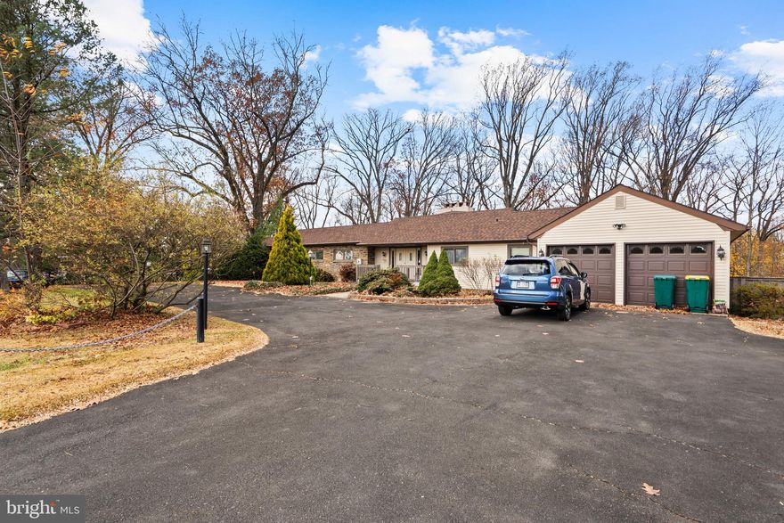 Welcome to 164 Trenton Road.Discover this truly one of a kind custom ranch home offering exceptional space,character and serene surroundings. The main walk in level features a welcoming large foyer ,stunning living room with huge picture windows and centerpiece stone fireplace. The formal dining room and eat in kitchen make for perfect gatherings. Two comfortable bedrooms and two full baths complete this level providing both style and functionality.
The full finished lower level offers incredible versatility-featuring two additional bedrooms,a full bath, large family room with a continued decorative stone fireplace. A powder room,heater room and an oversized utility /laundry room complete this lower space. Enjoy the incredible outdoors from the wraparound second floor deck or relax in the huge sunroom overlooking the private rear yard and large scenic spring fed pond. The exterior boasts a paver front patio ,circular driveway and an attached one car garage,adding to the home's curb appeal and convenience. A rare opportunity for multi-generational living or anyone seeking space,comfort and natural beauty-all in one remarkable property. Call today for your private showing. 
Please note: Seller believes Doylestown records is incorrect. Building plans indicate the stated square footage. Buyer to do their own due diligence and determine the square footage.