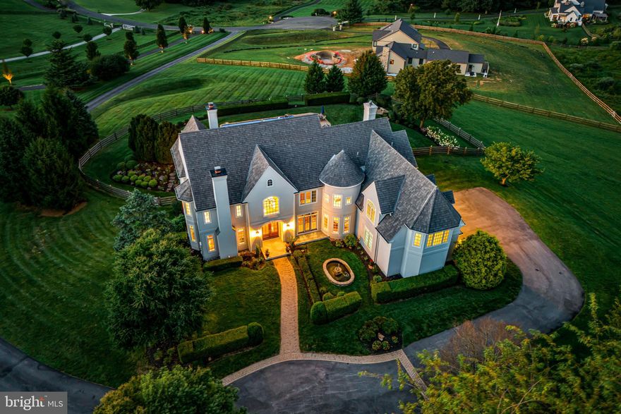 Simply spectacular in every way!!! This incredible better than new, custom-built, sun-filled residence was beautifully designed by Peter Batchelor, meticulously crafted by Dan Stoudt and is set on a beautiful 4-acre lot with pool and breathtaking views of the countryside and unparalleled sunsets. Fabulous first floor features include a stunning 2-story entrance foyer with curved staircase, opening up to the surrounding living room with gas fireplace, dining room with windowed piano space, expansive gourmet kitchen with artesian cabinets, granite countertops, Thermador, SubZero, Miele appliances and wet bar/ butler's pantry surrounding the large working/ eat-in island, adjacent breakfast room with windows and French doors looking out over the vast terraces, pool and grounds, inviting family room with media built-ins and cozy fireplace, private office, screened-in porch and convenient mudroom with powder room, rear staircase and access to the oversized 3-car garage. The spacious second floor offers a luxurious primary suite with sitting room, gas fireplace, his and hers baths renovated in 2023, walk-in closets, 2 additional large hall bedrooms each with a custom-tiled en-suite bathroom, and an expansive 4th bedroom/ in-law suite with custom marble bathroom featuring a soaking tub and frameless glass shower. The full, dry walk-out lower level is ready to finish with high ceilings, abundant space for multiple rooms, endless storage and easy access to the pool area, terraces and outdoor living spaces. An extensive list of the recent improvements/ renovations is available and includes a 40-year cedar shake roof , lighting, new systems, appliances, generator, primary bathroom and Florida room renovations and complete stucco remediation/ replacement in 2023. Move right in and enjoy all that this incredible Chester County property has to offer, close to renowned schools, endless recreational, dining and shopping opportunities, world class golf and equestrian facilities and more!