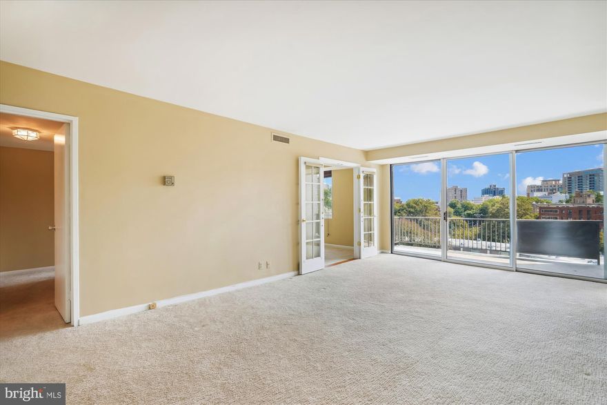 Welcome to this stunning two-bedroom, two-bath condo, where style, convenience, and sophistication unite effortlessly.  The home is move-in ready with fresh paint, plush carpeting, and new kitchen and dining room flooring.  The sun-filled living room creates a warm and inviting atmosphere, perfect for relaxing or entertaining guests.  The kitchen boasts like-new white appliances and offers a charming dining room view, beautifully illuminated by upgraded floor-to-ceiling windows.  Separately deeded, covered, parking space is also included! 

The spacious primary bedroom features an ensuite bath and not one but two walk-in closets, providing ample storage space.  The second bedroom is equally impressive, with a bonus entrance through elegant French doors, offering flexibility for use as a guest room, home office, or den.  With a recently serviced HVAC system and new light fixtures throughout, comfort and efficiency are at the forefront.  Step out onto the balcony to enjoy treetop views and an incredible glimpse of the Bethesda skyline.  This condo is the perfect blend of modern upgrades, style, and location—don't miss your chance to make it yours!

And talk about location!  Whitehall, set amidst seven acres in Downtown Bethesda, has easy access to two Metro stations (Bethesda Metro and Medical Center) and is minutes from the diverse dining options and great shopping in Bethesda, offering the best of convenience and entertainment.  Harris Teeter, CVS, Trader Joe's, Olazzo, Woodmont Grill, Seventh State, and Hip Flask's rooftop are a stone's throw away.  Whitehall offers professional on-site management, Amazon hubs, laundry facilities on each floor, main-level storage, a gym, an outdoor pool, walking paths, and plenty of green space for pets.  The condo fee includes all utilities and parking, making accounting a breeze!  Minutes to DC and VA and major commuter routes.