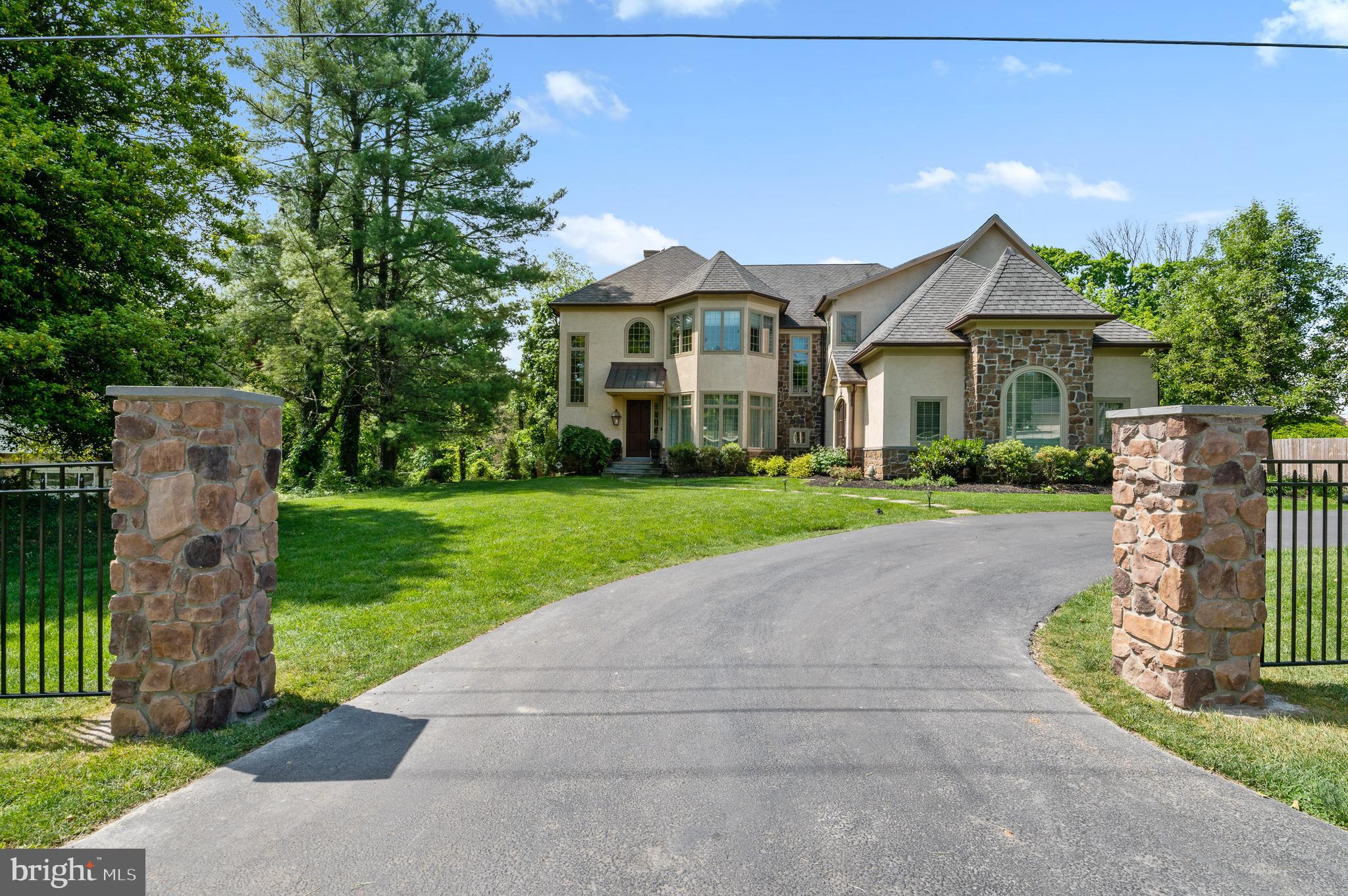 Custom built by a builder as his own residence, this spectacular home was thoughtfully designed and superbly constructed. Impeccably maintained, it shows like a designer model home. The open floor plan, soaring ceilings, and high quality finishes combine to make this home very special. Enter the two-story foyer that leads into the main living areas. Hardwood flooring and windows abound creating an abundance of light and luxury throughout. The dining room is spacious and opens to the family room with a stone fronted wood burning fireplace and custom built-in cabinets and shelving. The open flow continues into the gourmet kitchen that features granite countertops, plenty of cabinetry, a large center island with counter-height seating, high-end stainless-steel appliances, and a separate bar area with a wine fridge and sink. The adjoining breakfast area keeps everyone connected. Two first-floor home offices provide privacy and comfort while you work remotely. . The mudroom of the kitchen leads to the heated attached garage with a car lift accommodates four vehicles. Two powder rooms complete the main floor. Front and rear staircases ascend to the second floor where you will find the four lovely bedrooms. The spectacular primary suite features a wood burning fireplace, a coffee station, a charming balcony overlooking the rear yard, two walk-in closets with custom cabinetry, and two luxurious bathroom suites, each with their own large glass enclosed shower (one with soaking tub). Three spacious bedroom suites each have their own private bathrooms. . The second floor is complete with the large laundry room and a stairs to a walk-up attic. The exquisitely appointed lower level is highlighted by 10-foot ceilings, gym area, a billiard/game room with bar seating, a home theater area with a wood burning fireplace, and a play area perfect for young children. Outside, relax on the rear flagstone terrace or around the built-in fire pit. The fenced in yard makes for a private and peaceful outdoor experience. Other amenities include a full house generator, a Sonos system, stucco installed to the latest industry standards, a hardwired security system and many more. Located in walking distance to the Devon train station, Devon Horse Show and in close proximity to award-winning schools, this home will be an absolute pleasure for its new owners.