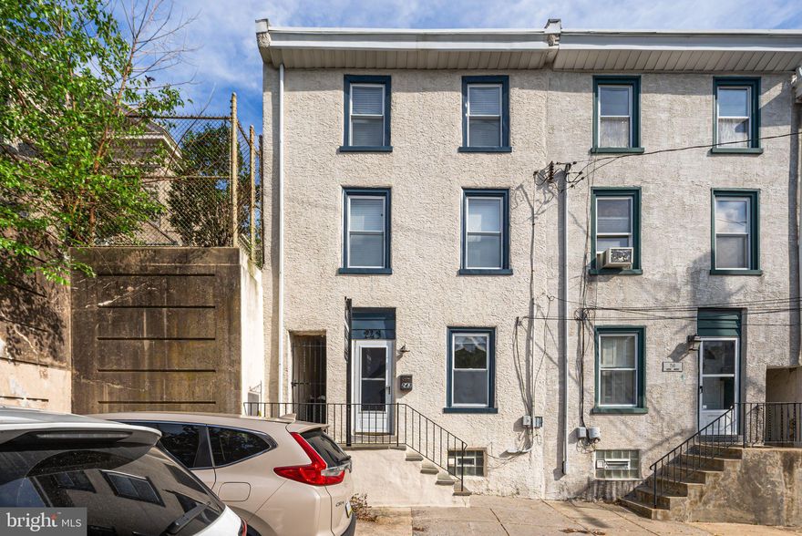 Welcome to 243 Gates Street, a beautifully maintained 3-bedroom, 3-bathroom rowhome nestled in the vibrant and walkable Manayunk neighborhood. Step inside and be greeted by warm, gleaming hardwood floors that flow through a versatile front space—currently used as a dining area, perfect for entertaining.

Beyond the central staircase, you'll find a cozy and inviting living room, leading seamlessly into a stylish kitchen outfitted with stainless steel appliances, sleek countertops, and abundant cabinetry for all your storage needs.

Upstairs, two well-proportioned bedrooms offer comfort and charm, including one with a stunning exposed brick accent wall. The shared full bathroom on this level features charming tile flooring and a large window that fills the space with natural light.

The third floor is home to the spacious primary suite, boasting hardwood floors, another gorgeous exposed brick wall, and a full en-suite bathroom with a glass shower and bright window.

Out back, enjoy a private, grassy yard—perfect for relaxing, gardening, or hosting gatherings in your own secluded green space.

Located just steps from vibrant Main Street, you'll have easy access to local shops, restaurants, and the Schuylkill River Trail. Plus, commuting is a breeze with SEPTA's Manayunk/Norristown Line nearby. A perfect blend of comfort and convenience!