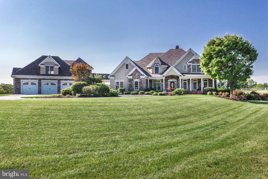 Stunning French Country Estate Home on 2.52 acres in Lothian! Gleaming hardwood floors! Lots of natural light throughout! Gourmet kitchen w/ center island & large eating area! Great room w/ stone 2-story fireplace! Main level master suite w/ luxurious bath, 2-walk-in closets & private walkout deck! Additional main level bedroom w/ full bath! All upper level bedroom are suites! Fully finished lower level w/ media room, gym & full in-law suite w/ kitchen & large bedroom w/ full bath! Detached 3 car garage w/ plenty of room for storage, tools & toys! Additional partially finished apartment above garage! Large private outdoor entertaining areas! Call today for your private showing!