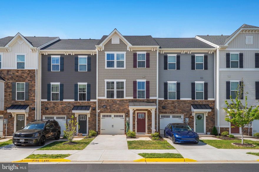 Welcome to this beautifully maintained 2023 Ryan Homes townhome in the sought-after
Loudoun Overlook community in Cascade. Located on a gentle hill, this home offers
scenic northwest views with distant glimpses of the Blue Ridge Mountains.
With approximately 2,340 square feet across four levels, this home features 4
bedrooms, 3 full baths, 2 half baths, and a 1-car garage. The open main level is bright
and inviting, showcasing luxury vinyl plank flooring and a modern kitchen with quartz
countertops, stainless steel appliances, an upgraded backsplash, a large island, and
direct access to the upper balcony with steps to the lower yard, perfect for everyday
living and entertaining.
The owners invested in thoughtful upgrades throughout, including an enhanced main
level powder room, hardwood flooring on all staircases, and recessed lighting
throughout the home.
The entry level offers a spacious family room with high ceilings, access to the garage,
and doors leading to a beautiful yard that backs to community amenities including
basketball, pickleball, and a playground.
Upstairs, the primary suite includes a walk-in closet and private bath with double
vanities and a walk-in shower. Two additional bedrooms, a full bath, and laundry
complete this level. The top floor features an additional bedroom or bonus space with a
full bath and access to a private rooftop terrace with beautiful sunset views.
Although the home is only three years old, the roof was recently replaced following a hail
storm last year, offering added peace of mind.
Enjoy community amenities such as a pool, courts, and playgrounds, all just across
from Claude Moore Park and minutes to shopping, dining, and major routes.