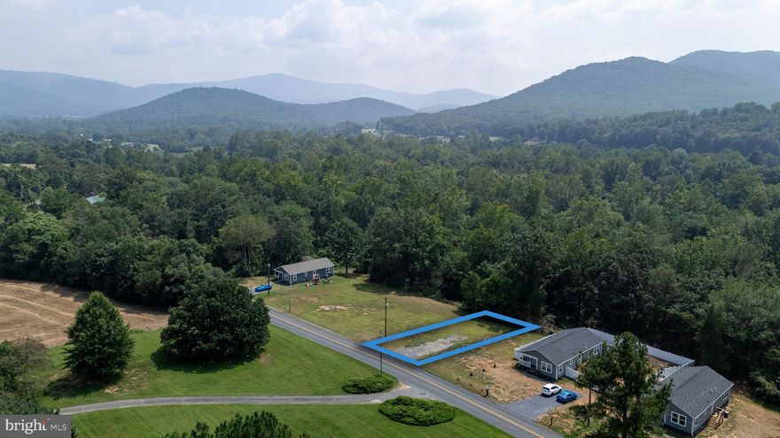 Discover this great building lot located in charming Elkton, VA! You'll enjoy a peaceful setting on a 0.25 acre lot near Elk Run Creek, while being only minutes away from Merck, Coors, restaurants, and the famous Elkton Brewery. There's already a plat on file, and easy access to Public Water & Public Sewer hookups. Come check it out today! Neighboring lots are available at the same price & size.