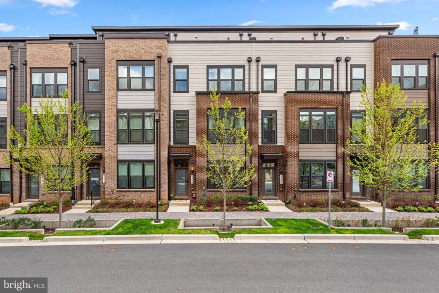 Best value by the Metro!   Stanley Martin’s popular and rarely available “The Vera” model in sought after Westside at Shady Grove walk-to-METRO community shows like new and features high-end upgrades throughout.....This is a wonderful opportunity to  own (Fee Simple, not a Condo) a well-appointed 4 Bedroom 4.5 Bath townhome. Highlights include: • Open-concept main floor w/an impressively expansive Kitchen, Family & Dining Room - perfect for gathering and entertaining • Spacious side-by-side 2-car garage with built-in storage • Zoned Heating and Cooling • Nest Thermostats  • Luxurious primary bathroom with upgraded tile and stone  • High-quality engineered wood floors from the foyer to throughout the main level  •Fourth floor includes a private ensuite bedroom, a second family room complete with wet bar & wine fridge leading to a private rooftop terrace  • Foyer leads to the entry-level ensuite (4th) bedroom with full bath or use an an office  • Custom wood blinds installed throughout (a nice bonus)  • Upgraded Wiring Package installed • Nestled on a quiet tree-lined street with visitor street parking.  The amenities at Westside at Shady Grove Metro include a 25-meter outdoor pool, lounge areas, party room, meeting room, fitness center, two dog parks, a playground, and jogging/walking paths, and is within walking distance to Starbucks, Giant, CVS, local restaurants/retail and of course the metro station.   Conveniently located just off I-270/370/355.