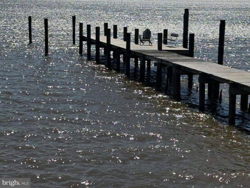 *****OPEN HOUSE: Saturday, June 14th , 1PM to 5PM.  Pre-Registration and Appointment Required. $25,000 Closing Cost Incentive for Settlement by 7/4/2025, More!!!*****PRIME WATERFRONT PROPERTY in HIGHLY SOUGHT AFTER “LONG BEACH ESTATES” Start LIVING WELL and Let the GOOD TIMES and MEMORIES Get Started. HAVE the Parties and Fun proudly at "Your Place" starting this Year**ESTATE SALE OPPORTUNITY **Long-Time Owner Enjoyed, and Loved, SIXTY-FIVE (65) Years Living Here. History, Charm and Character and an Awesome Setting Conducive to Peaceful, Serene, Good Quality Living, to Enjoy the Waterfront Lifestyle Year Round for Many Years.  Stop Wasting Time and Live Your BEST LIFE***FIND THE KEYS TO WATERFRONT ENJOYMENT HERE: NO FLOOD INSURANCE, DIRECT WATERFRONT, DEEP WATER, PRIME LOCATION, LOCATION, LOCATION w/WONDROUS AND FULL, LIVING MURAL, SCENIC VIEWS, SUNSETS, and SOUTHERN BREEZES, LOVELY, LARGE and LEVEL, .98 ACRE (Double Lot (2 Lot Numbers)) Setting, LONG, 140' PRIVATE PIER w/Wide Planks and Boat Tie-Up Pilings Accommodates Good Sized Boats, 110' Concrete Bulkhead w/Sidewalk, Easy, Private WATER ACCESS on Middle River and to the Chesapeake Bay, and Road Access to Area Amenities and Popular Places, Lots of SUN and FUN on the Water: Boating, Jet Skiing, Water Skiing, Sailing, Kayaking, Fishing, Crabbing, Swimming, Marvelous Sunsets, Wondrous Skies and Clouds, Local Waterside Dining Establishments, Holiday and Special Events, including Fourth of July Fireworks (Front Row  View Seats from the Front Yard), and Christmas Boat Parades***100’ Road Footage, Long Asphalt Driveway and Parking Area, 2-Car Detached Garage Footprint, Lovely YARD SPACE W/Mature Landscape, Trees, including Hollies and Crepe Myrtles, Water Birds, including Sea Gulls, Osprey, Ducks, Geese, and an Abundance of Other Nature, Critters and Natural Beauties. Lots of Room to Run and Play for Humans and Animals or House/Garage Expansion/Reconstruction Potentials**Detached Rancher Style Home**Formal Living Room w/Wood-Burning Fireplace w/Mantle, Decorative Archways, Multiple Tall French Doors, and Built-Ins**Dining/Kitchen Combination w/Dining Table Area and All Appliances Included**3 Bedrooms, Each Bedroom has a Water View, Primary Bedroom w/Bay Window Water View, Bedroom 2 w/Water View, Bedroom 3 / Family Room / Home Office / Party Room w/Water View**Waterfront Enclosed Porch w/Jalousie Door to Front Yard, Side Enclosed Porch, Rear Enclosed Porch w/Cathedral Ceiling and Glass Sliders to the Rear Yard**Full Bathroom w/Shower/Tub Combination**Pull-Down Attic Stair to Large Attic**Partial Basement w/Laundry and Mechanicals Area**Rear Concrete Patio**All Existing Appliances, Lighting Fixtures, Ceiling Fans and Other Extras Included**Exterior Awnings and Flood Lighting**Public Water and Public Sewer**NO HOA**Limited Photos in MLS for Privacy and Security of Seller and New Buyers**COME TAKE A LOOK w/In-Person Appointment or at Open House**Terms Include: Sold As-Is, Cash, Cash-Like, Private Funds, Approved Financing, Quick Settlement is Available and Desired to Settle Estate, PRLBFI**”Buy It Today” You and Your Guests will Love the Time Spent, the Crab Feasts and Cook-Outs, the Fun on the Water, and the Wonderful Memories Made to Enjoy Forever.  A Special Place !!!